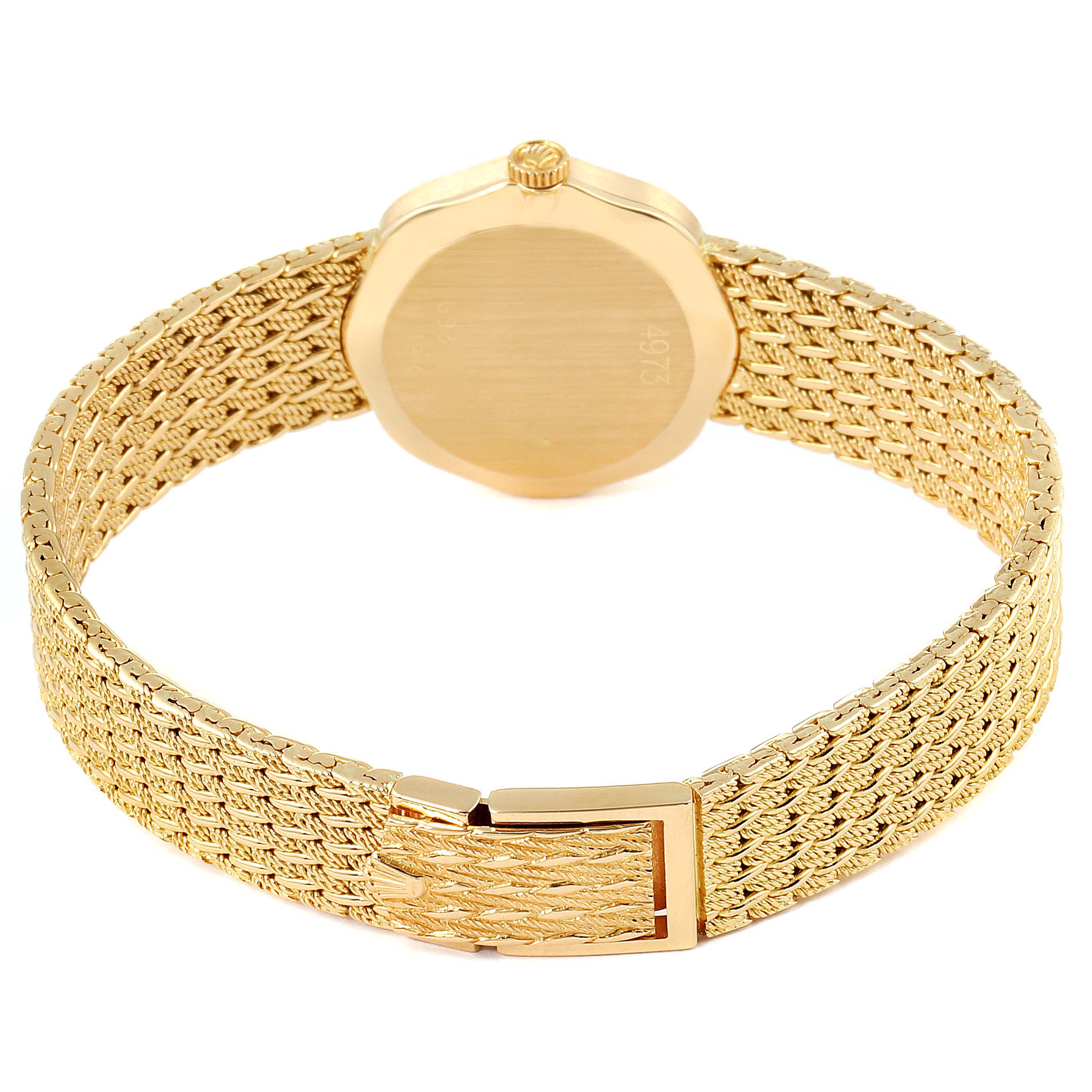 The image shows the Rolex Cellini 4973 Women's Yellow Gold Champagne Dial 4973 Women's Yellow Gold Champagne Dial watch from the back, highlighting the gold case and the textured gold bracelet.