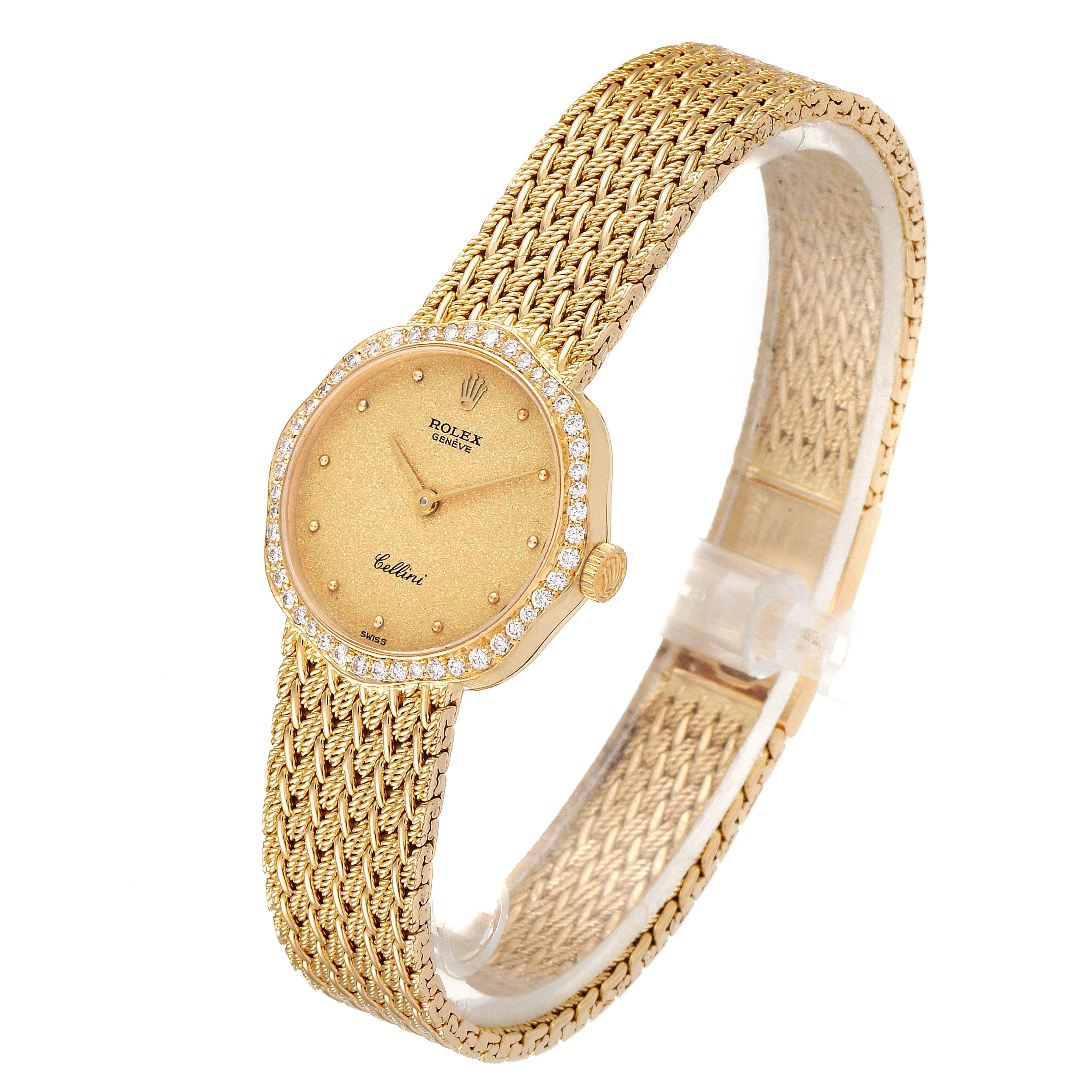 The image shows a side angle of a Rolex Cellini 4973 Women's Yellow Gold Champagne Dial 4973 Women's Yellow Gold Champagne Dial watch, highlighting its gold dial, diamond bezel, and intricate bracelet.