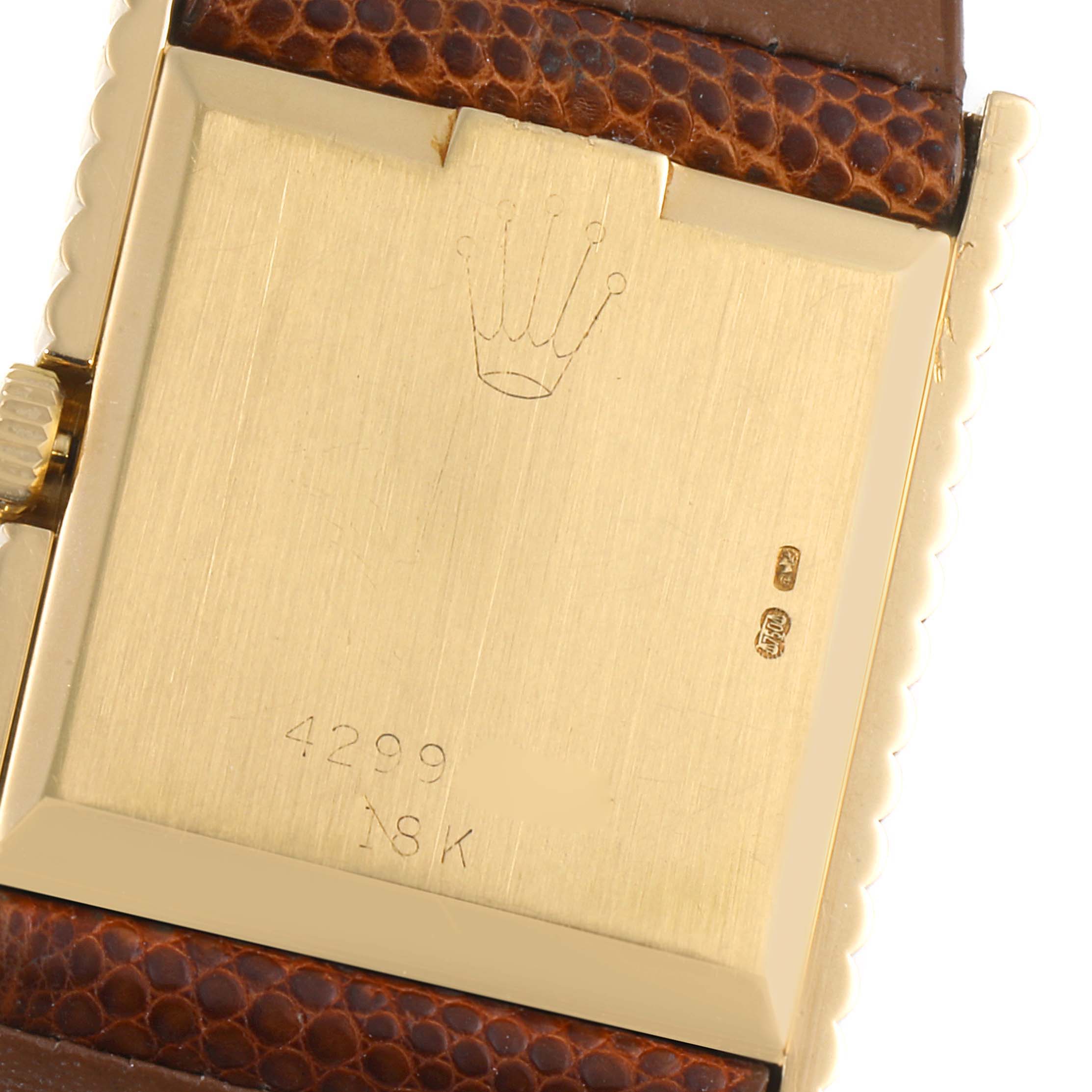 This image shows the back of the Rolex Cellini 4012 Men's Yellow Gold Champagne Dial 4012 Men's Yellow Gold Champagne Dial watch, highlighting its 18K gold case, serial number, and leather strap.