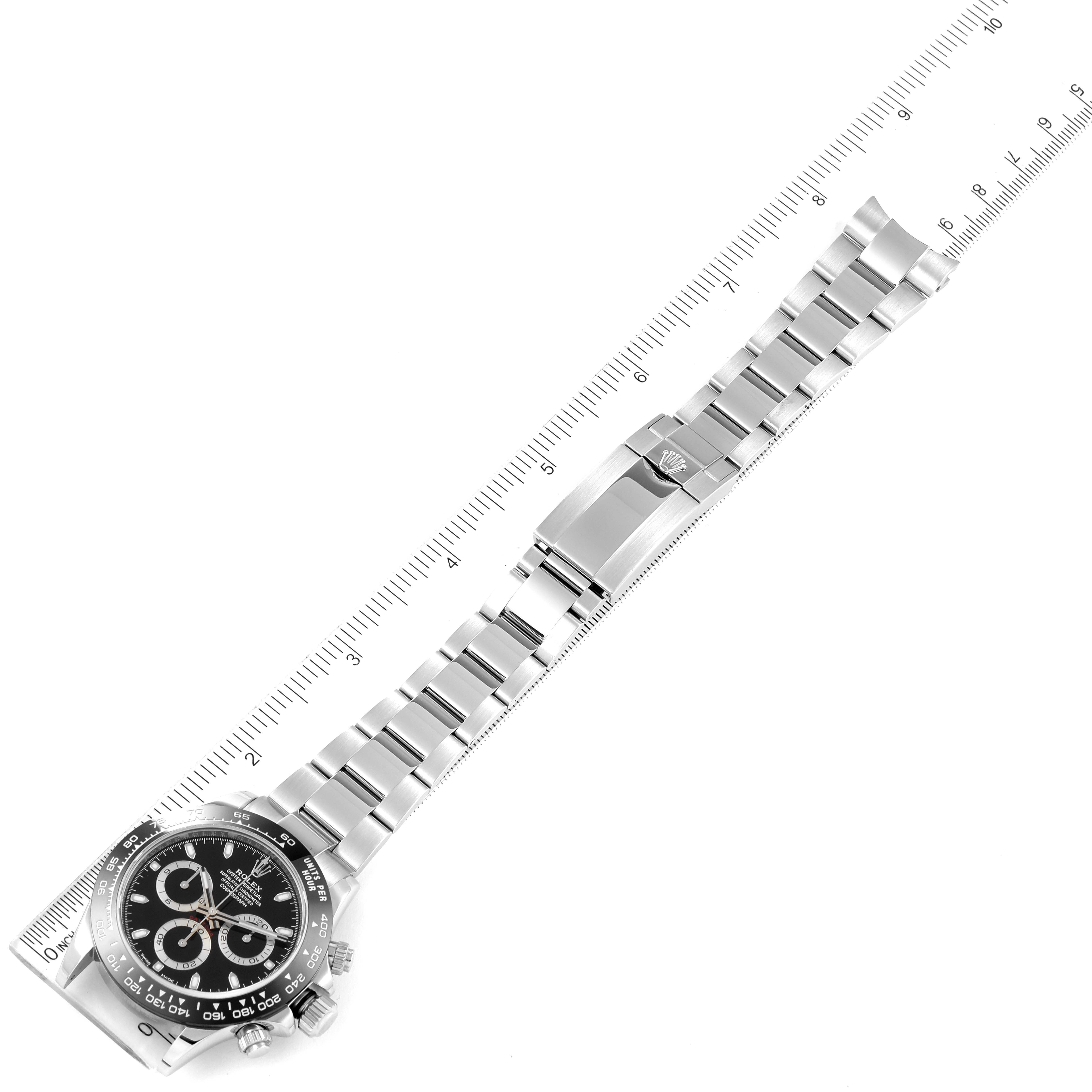The image shows a top-down view of a Rolex Daytona 116500 Men's Stainless Steel Black Dial 116500 Men's Stainless Steel Black Dial watch, including the watch face, bracelet, and clasp.