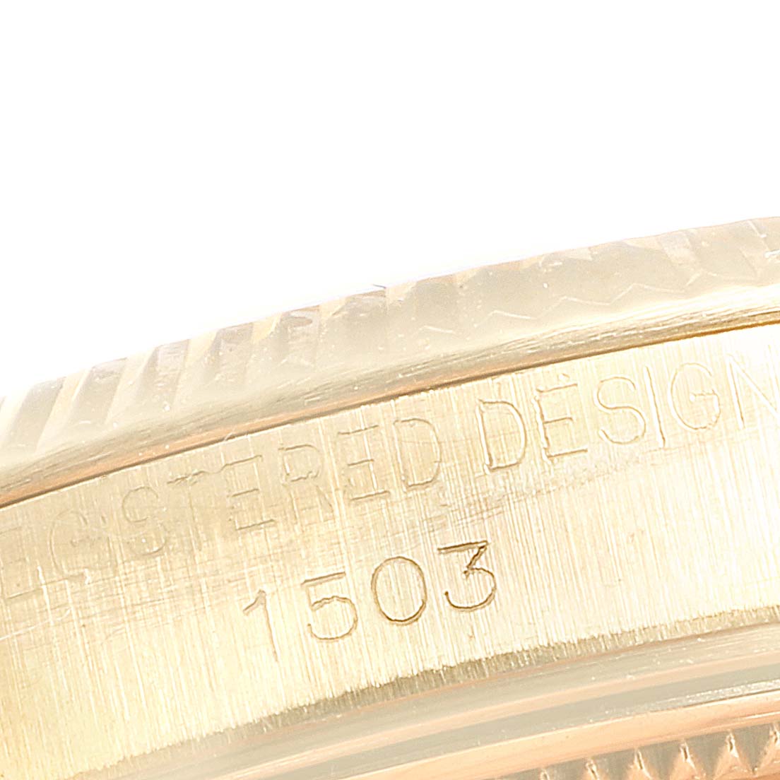 This image shows a close-up side view of the Rolex Vintage Collection 1503 Men's Yellow Gold Champagne Dial 1503 Men's Yellow Gold Champagne Dial model, focusing on the case with engraved design details and the model number 1503.