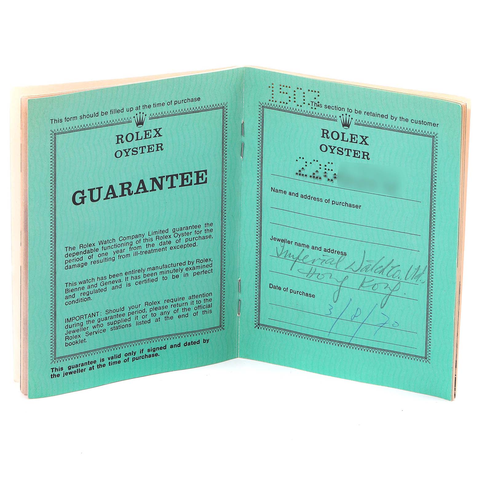 The image shows an open guarantee booklet of a Rolex Oyster Vintage Collection model, displaying warranty details.