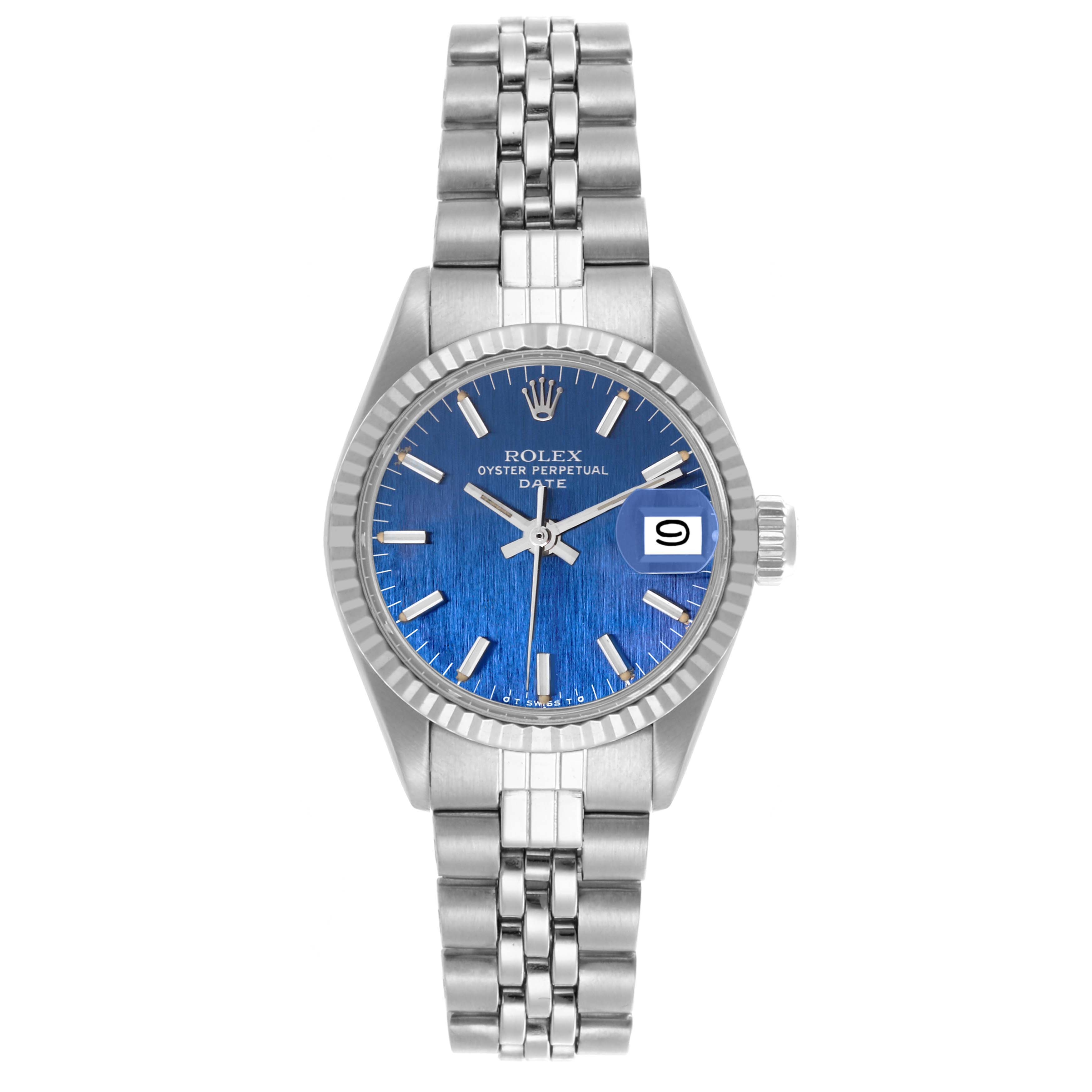 The Rolex Date 6917 Women's Stainless Steel Blue Dial 6917 Women's Stainless Steel Blue Dial watch is shown from the front, displaying its blue dial, fluted bezel, and Jubilee bracelet.