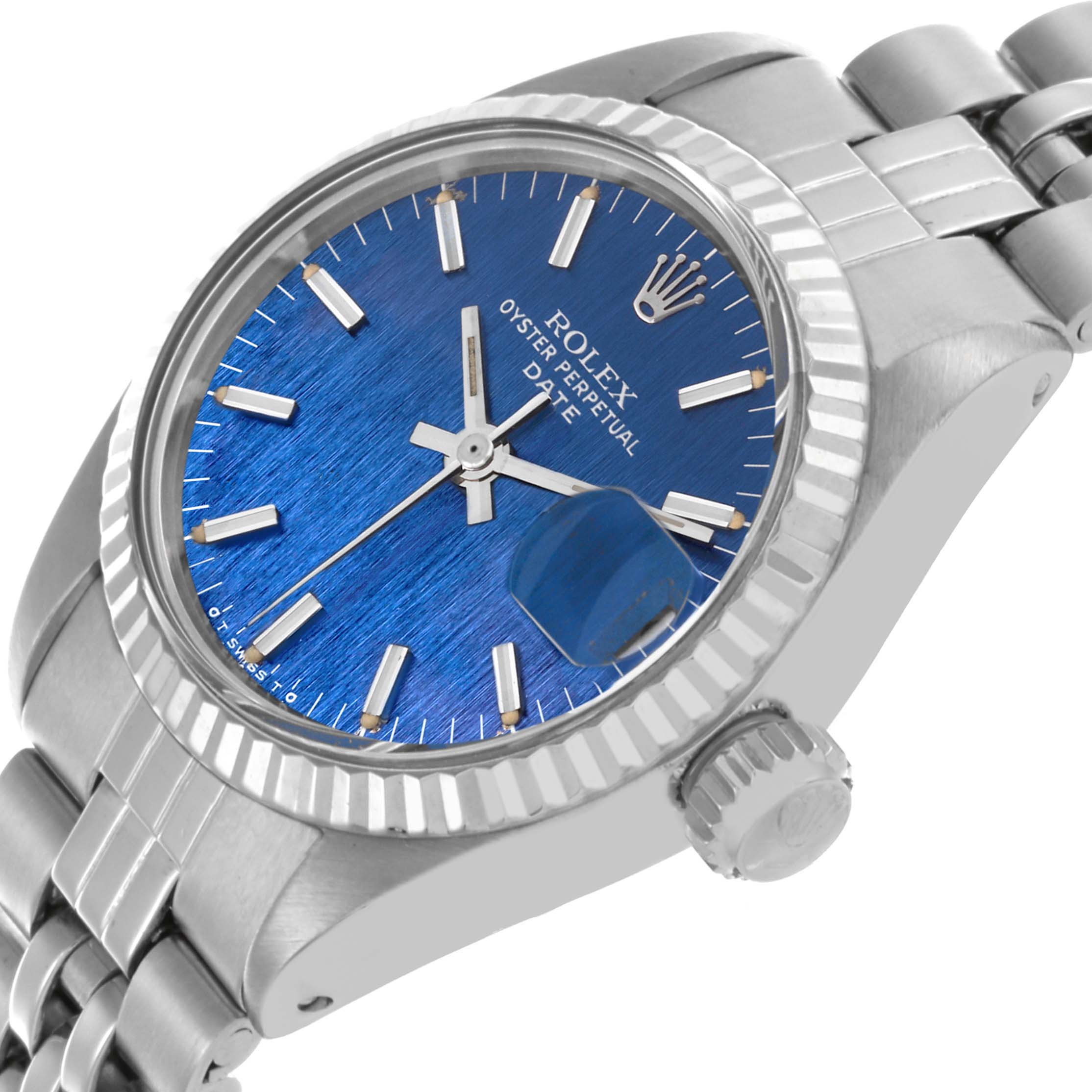 The Rolex Date 6917 Women's Stainless Steel Blue Dial 6917 Women's Stainless Steel Blue Dial watch is shown at a slight angle focusing on the blue dial, fluted bezel, and bracelet.