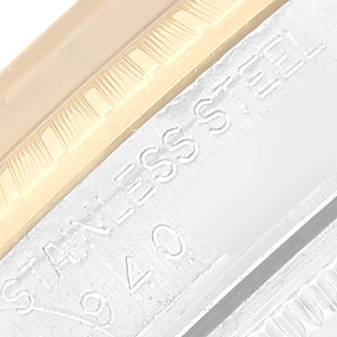 This close-up image shows part of the bezel and the stainless steel case of a Rolex Date 15053 Men
s Steel and Gold (two tone) Champagne Dial 15053 Men
s Steel and Gold (two tone) Champagne Dial watch.