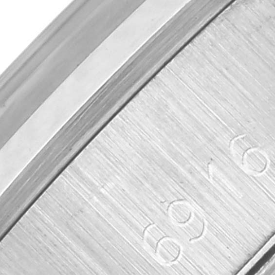 The image shows a close-up of the side of the bezel and case of a Rolex Date 6916 Women's Stainless Steel Silver Dial 6916 Women's Stainless Steel Silver Dial model watch.