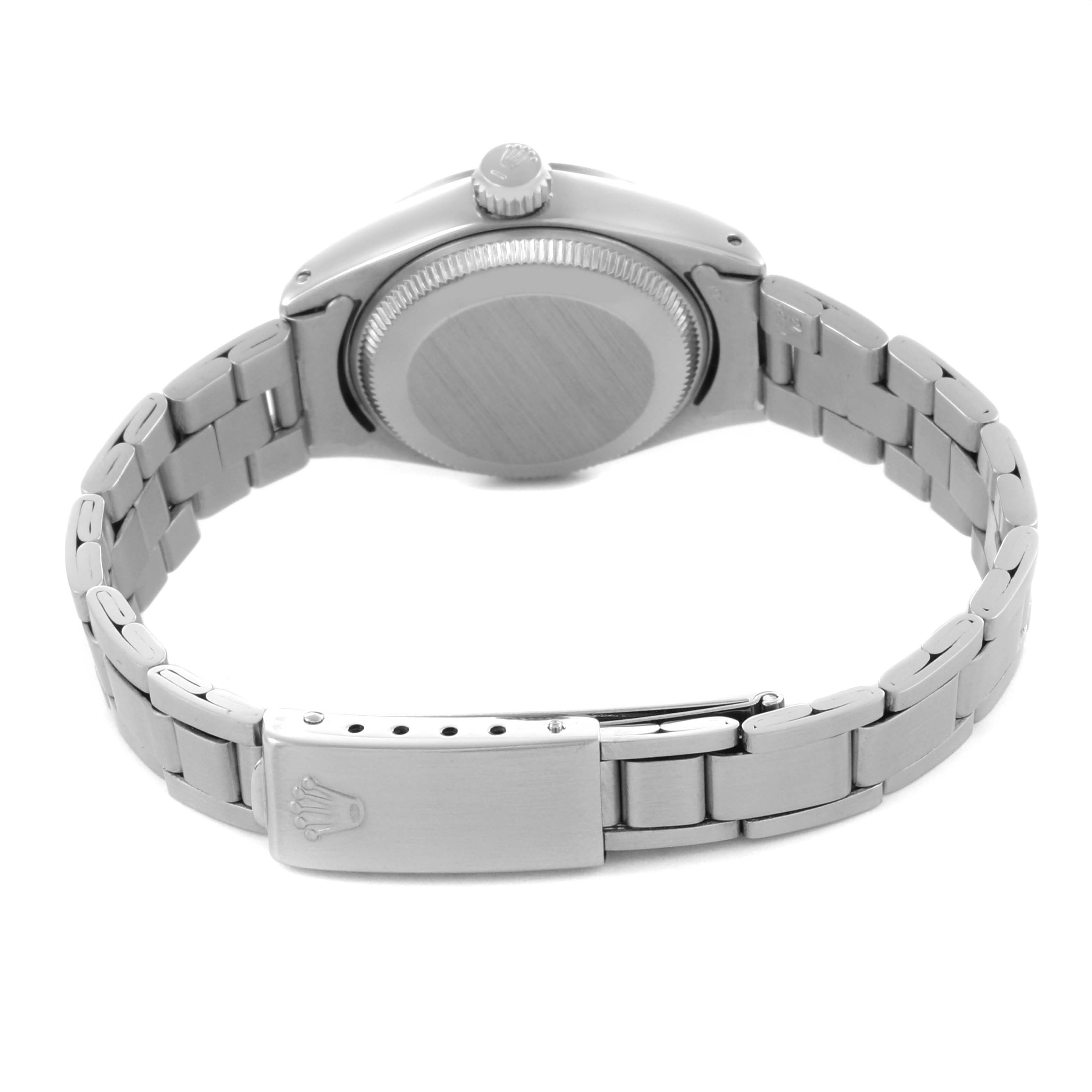 The Rolex Date 6916 Women's Stainless Steel Silver Dial 6916 Women's Stainless Steel Silver Dial model is shown from the back, highlighting the case back and bracelet with visible clasp and crown.