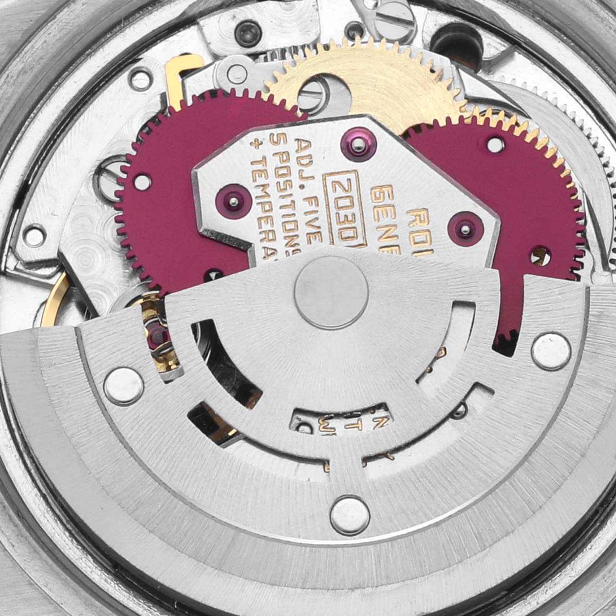 The image shows a close-up of the internal movement of a Rolex Date 6916 Women's Stainless Steel Silver Dial 6916 Women's Stainless Steel Silver Dial watch, highlighting gears and the rotor.