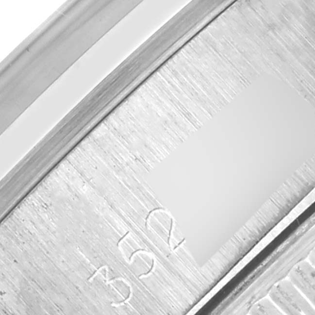 The image shows a close-up of the engraved inner clasp or bracelet of the Rolex Date 6916 Women's Stainless Steel Silver Dial 6916 Women's Stainless Steel Silver Dial watch.