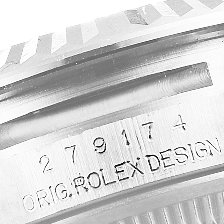 The image depicts a close-up view of the serial engraving on a Rolex Datejust 279174 Women's Stainless Steel Silver Dial 279174 Women's Stainless Steel Silver Dial watch case.