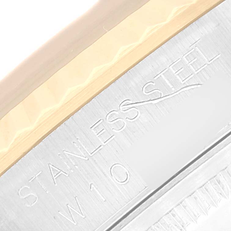 The image shows a close-up of the case side of a Rolex Datejust 16233 Men's Steel and Gold (two tone) Blue Dial 16233 Men's Steel and Gold (two tone) Blue Dial, highlighting the "Stainless Steel" engraving.