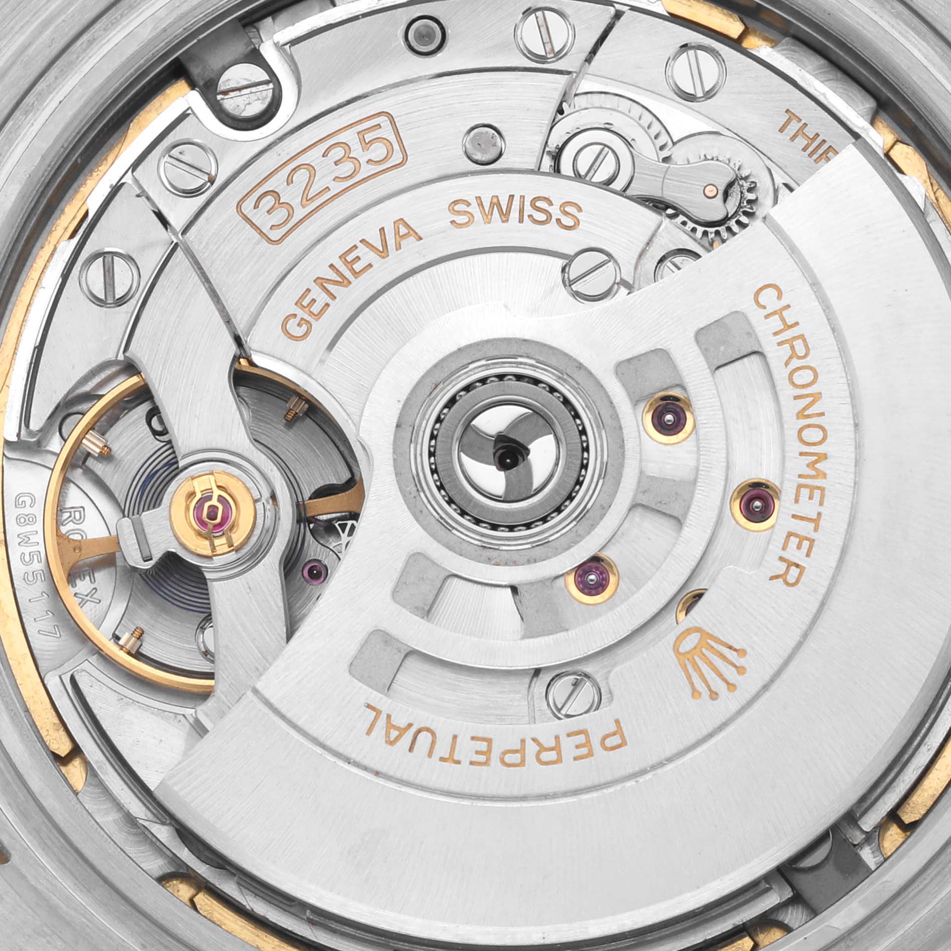 The image shows the movement mechanism of a Rolex Datejust 41 126303 Men
s Steel and Gold (two tone) Champagne Dial 126303 Men
s Steel and Gold (two tone) Champagne Dial, highlighting the rotor and intricate details of the Caliber 3235.