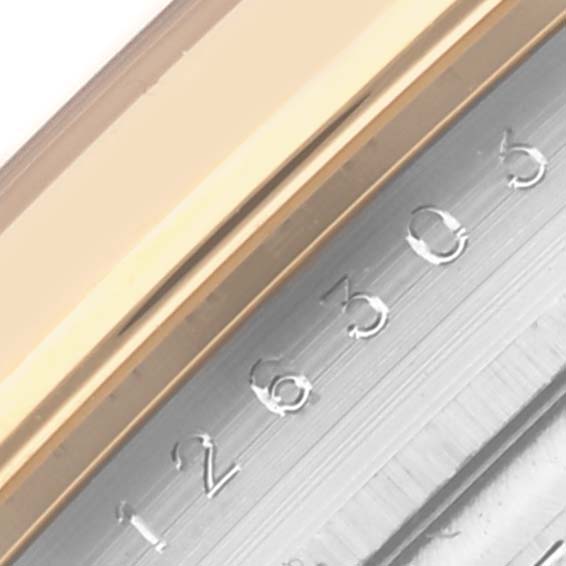 The image shows a partial side view of the Rolex Datejust 41 126303 Men
s Steel and Gold (two tone) Champagne Dial 126303 Men
s Steel and Gold (two tone) Champagne Dial
s case, highlighting the engraved numbers and bezel edge.