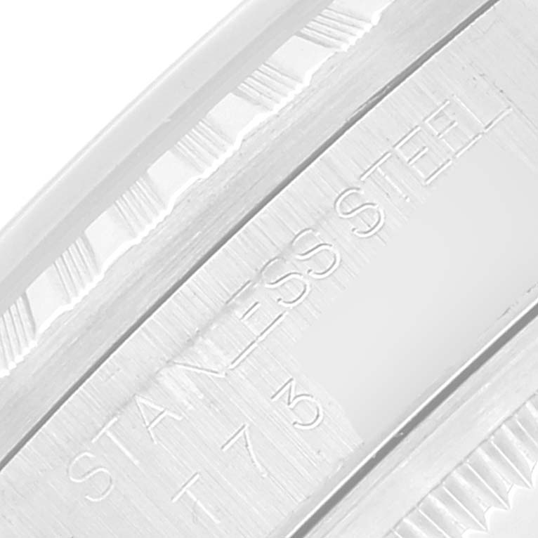 The image shows a close-up of the stainless steel bezel with engravings on a Rolex Datejust 16220 Men's Stainless Steel Blue Dial 16220 Men's Stainless Steel Blue Dial watch.