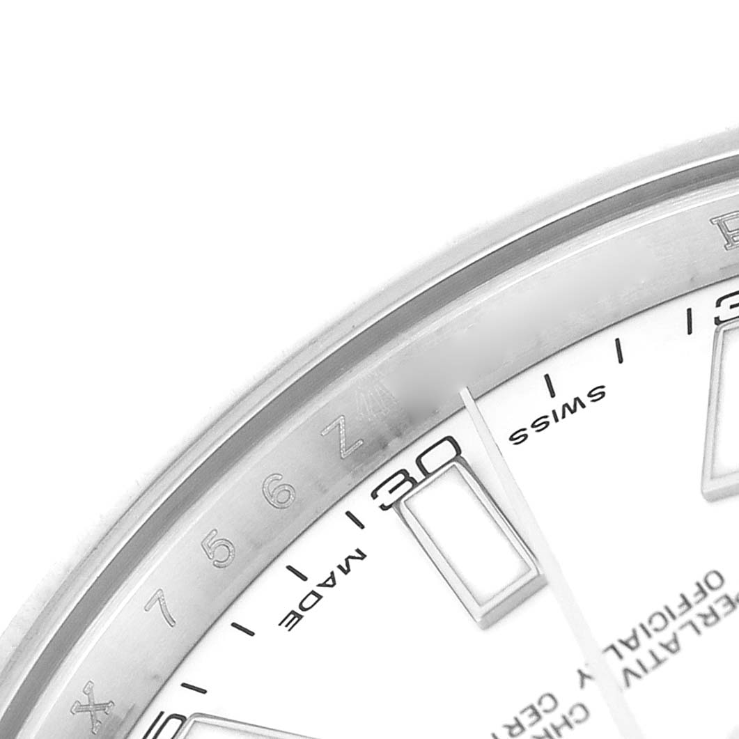 The image shows a close-up of the Rolex Datejust 41 116334 Men's Stainless Steel White Dial dial, highlighting the minute markings and part of the fluted bezel.