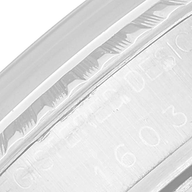 The image shows a close-up view of the edge and serial engraving on a Rolex Vintage Collection 1603 Men's Stainless Steel Silver Dial 1603 Men's Stainless Steel Silver Dial model.