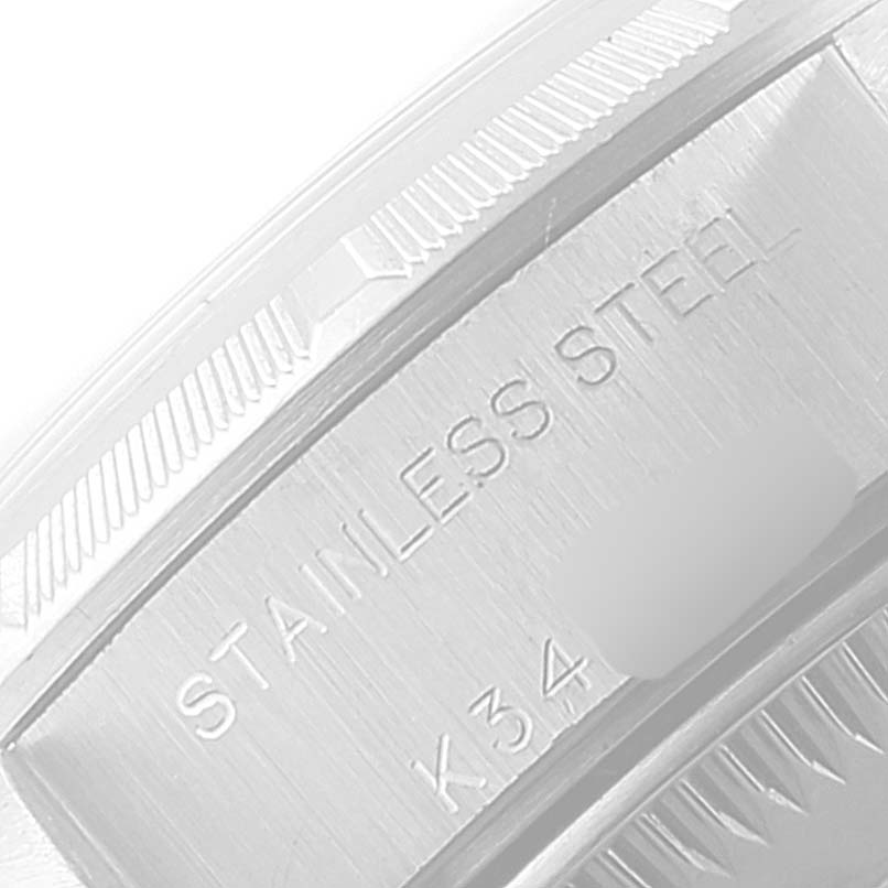 The image shows a close-up of the stainless steel bezel and serial number engraving on a Rolex Date 79190 Women's Stainless Steel Silver Dial 79190 Women's Stainless Steel Silver Dial model watch.