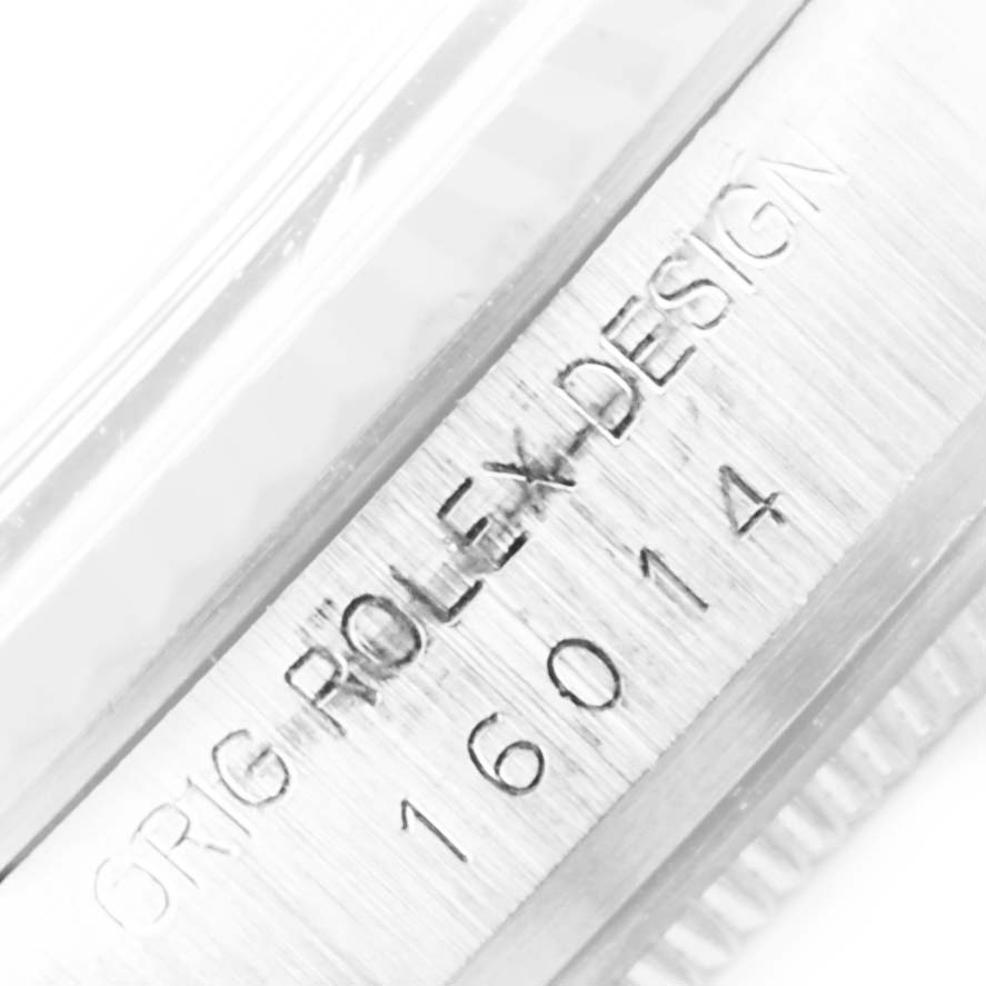This close-up image of the Rolex Vintage Collection 16014 Men
s Stainless Steel Silver Dial 16014 Men
s Stainless Steel Silver Dial model shows the engraved text "ORIG ROLEX DESIGN" and "16014".