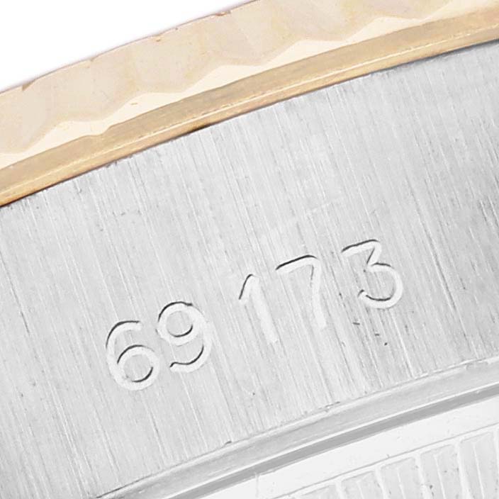This close-up image shows the model number engraved on the side of a Rolex Datejust 69173 Women's Steel and Gold (two tone) Champagne Dial 69173 Women's Steel and Gold (two tone) Champagne Dial watch case.