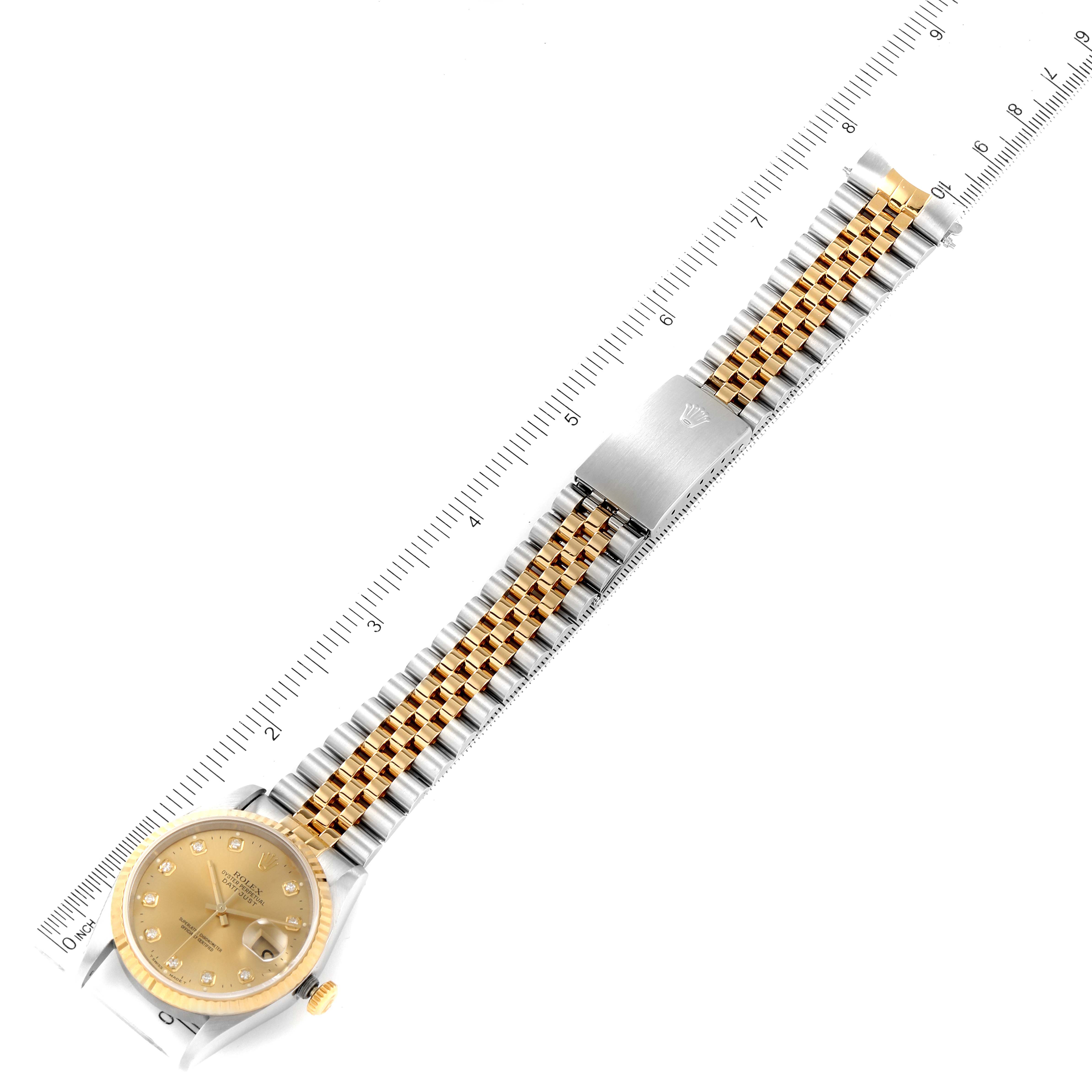 This Rolex Datejust 16233 Men
s Steel and Gold (two tone) Champagne Dial 16233 Men
s Steel and Gold (two tone) Champagne Dial watch is shown from a top-down angle, displaying the full strap, clasp, and watch face.