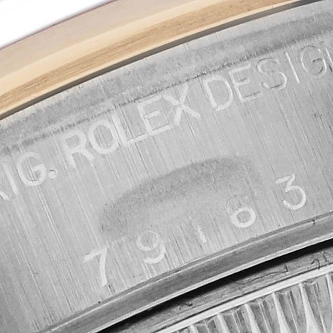 This image shows a close-up of the inner case side and serial engraving on the Rolex Datejust 79163 Women's Steel and Gold (two tone) Grey Dial 79163 Women's Steel and Gold (two tone) Grey Dial.