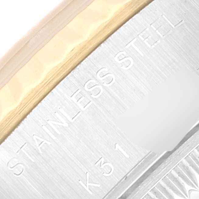 The image shows a close-up of the case back edge of a Rolex Datejust 79173 Women's Steel and Gold (two tone) White Dial 79173 Women's Steel and Gold (two tone) White Dial, highlighting the "STAINLESS STEEL" inscription.