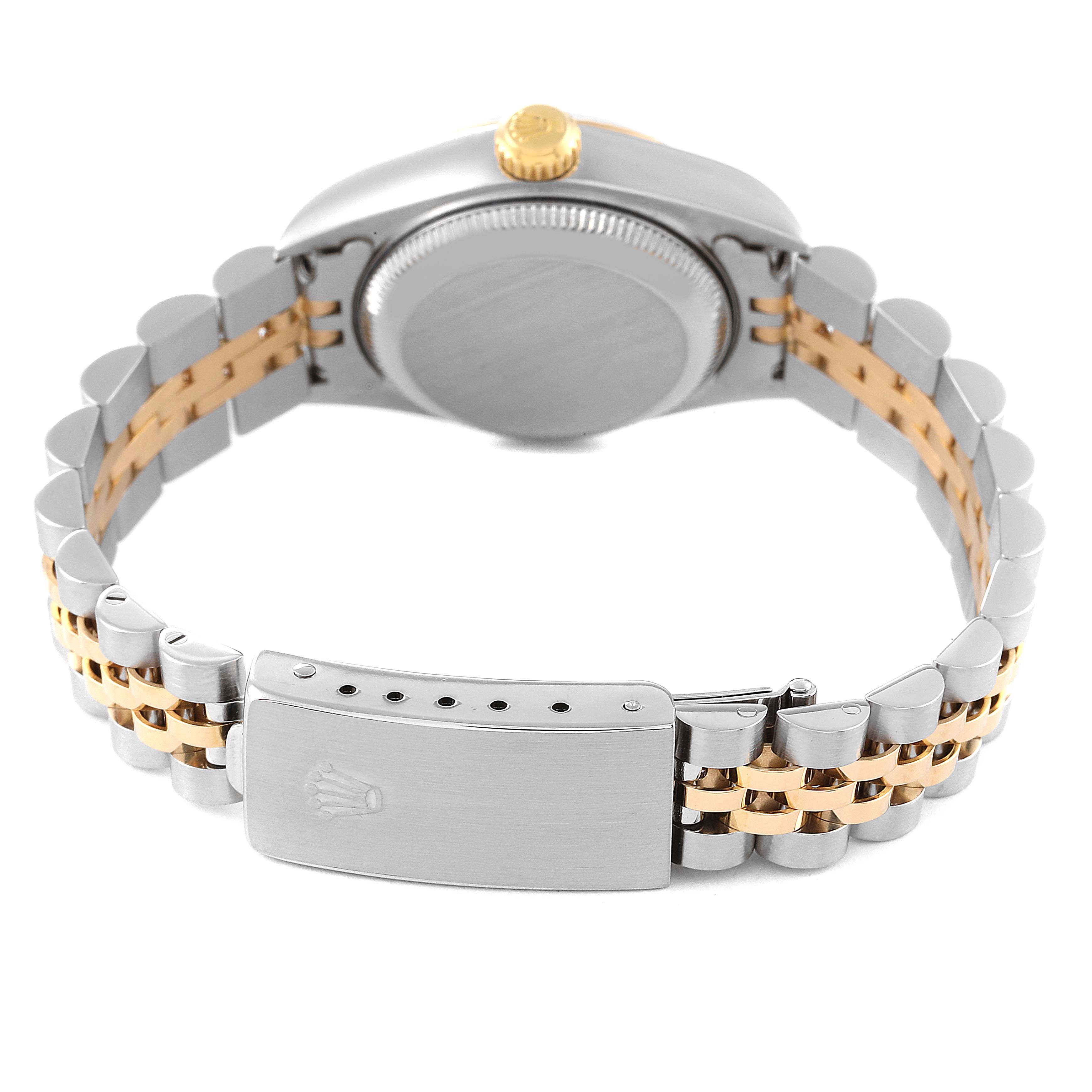 The image shows the back view of a Rolex Datejust 79173 Women's Steel and Gold (two tone) White Dial 79173 Women's Steel and Gold (two tone) White Dial watch, focusing on the case back, crown, and bi-color bracelet with a clasp.