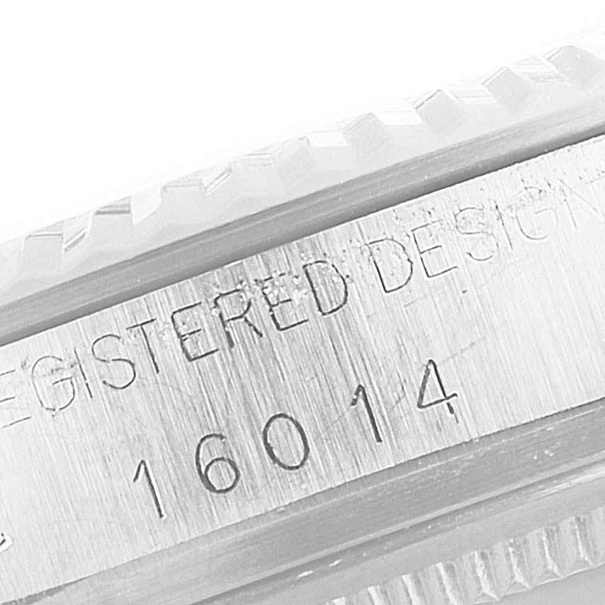 This close-up image shows the serial number and part of the bezel of the Vintage Collection model by Rolex.