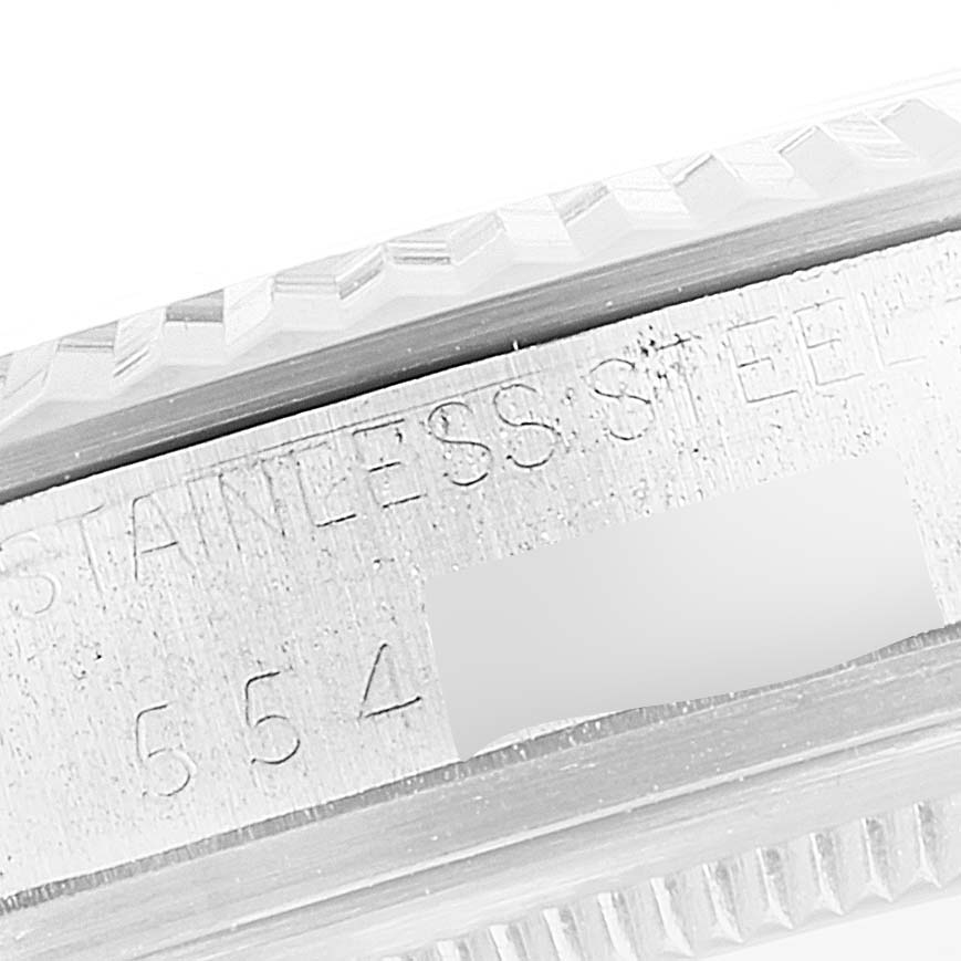 This is a close-up view of the side of the Rolex Vintage Collection 16014 Men's Stainless Steel Black Dial 16014 Men's Stainless Steel Black Dial watch, showing the stainless steel engravings.