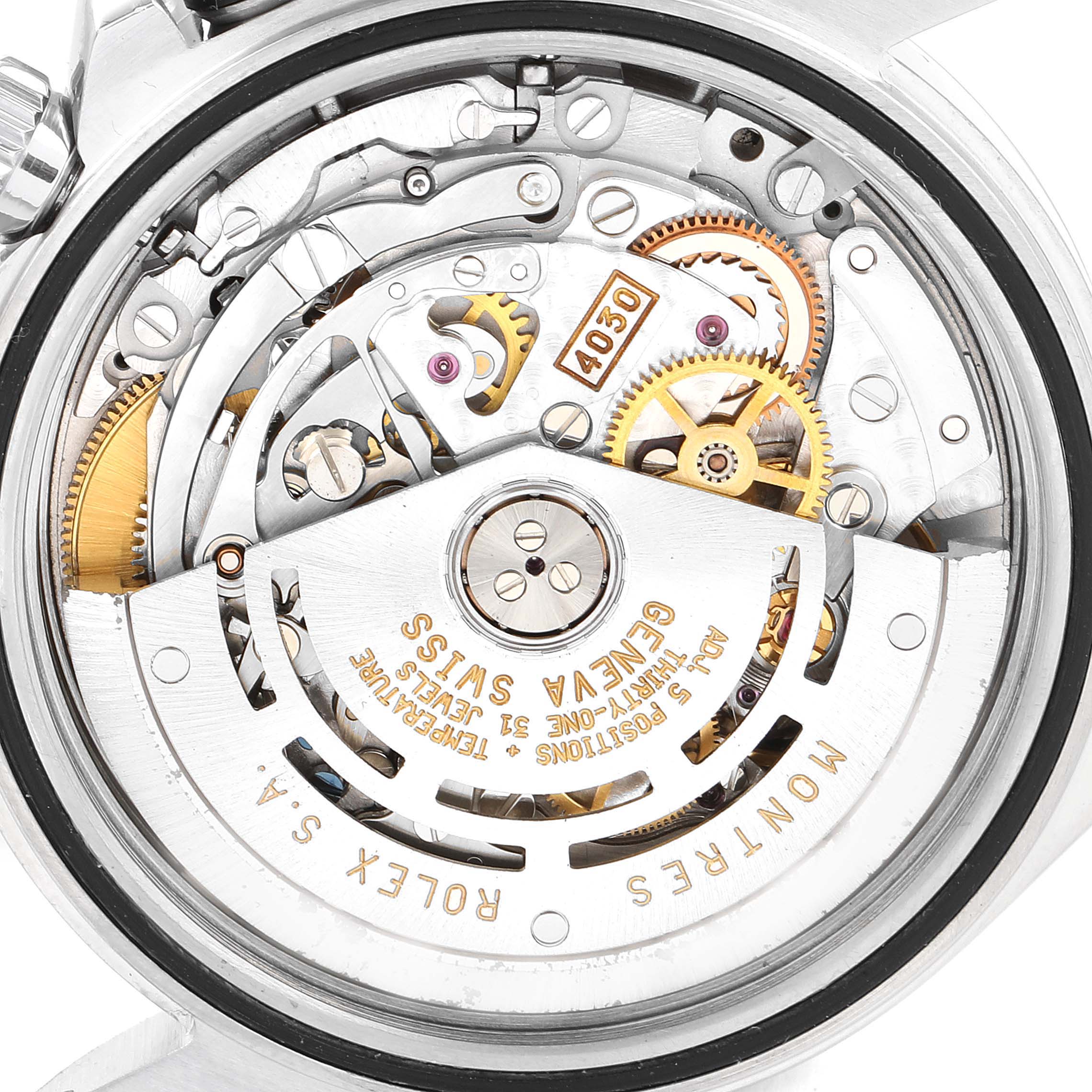 The image shows the back view of the Rolex Daytona 16520 Men's Stainless Steel Black Dial's exposed movement, highlighting gears and mechanical components.