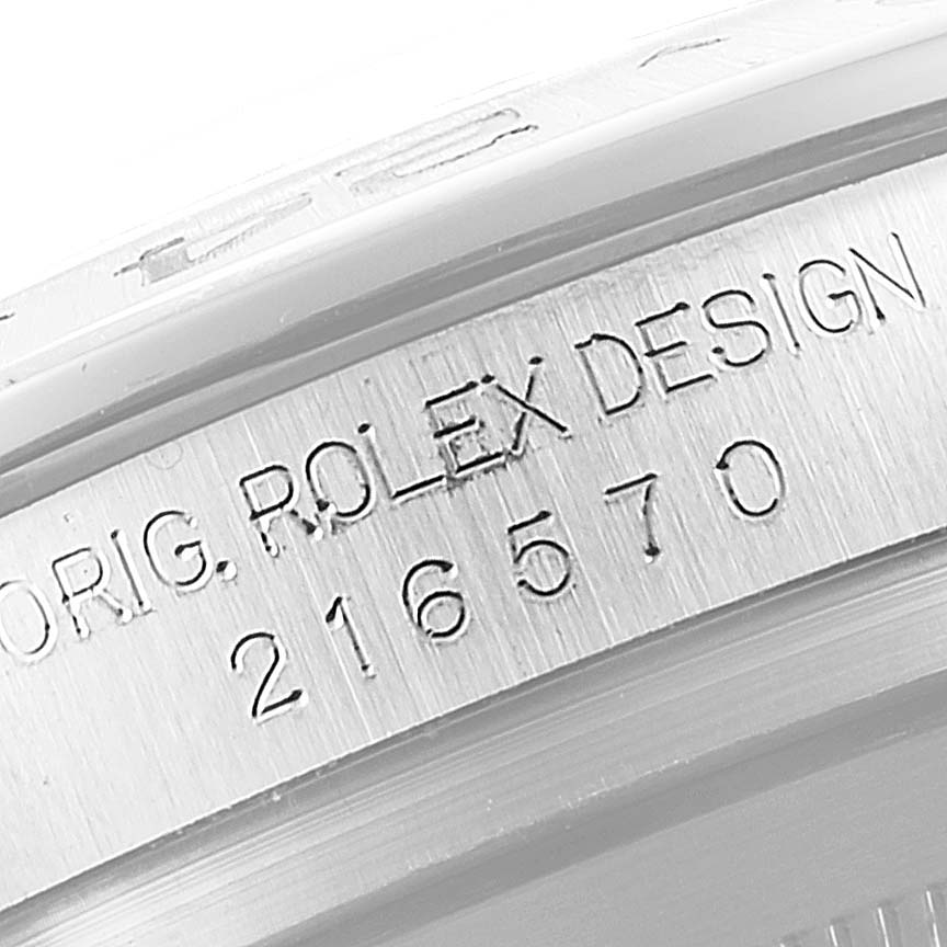 The image shows a close-up view of the case engraving on a Rolex Explorer 216570 Men's Stainless Steel Black Dial 216570 Men's Stainless Steel Black Dial watch.