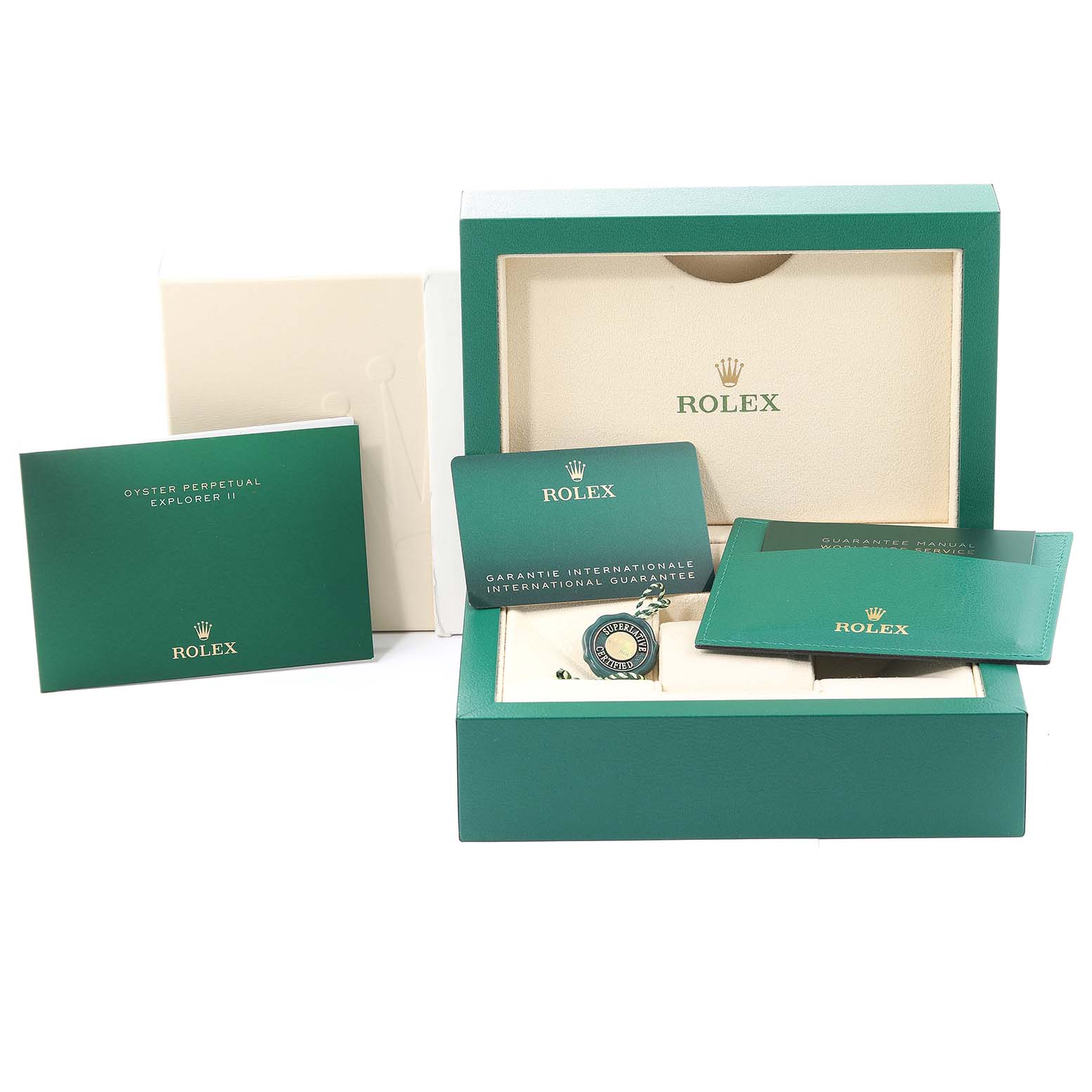 The image shows the packaging, manuals, guarantee card, and tags for the Explorer model by Rolex.