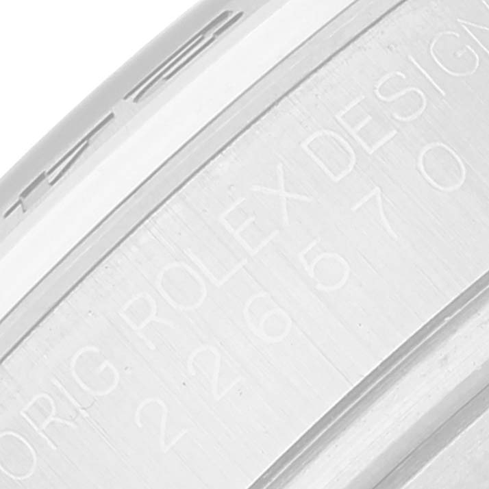 The image shows a close-up of the side engraving on the case of a Rolex Explorer Men's Stainless Steel Black Dial Men's Stainless Steel Black Dial watch.