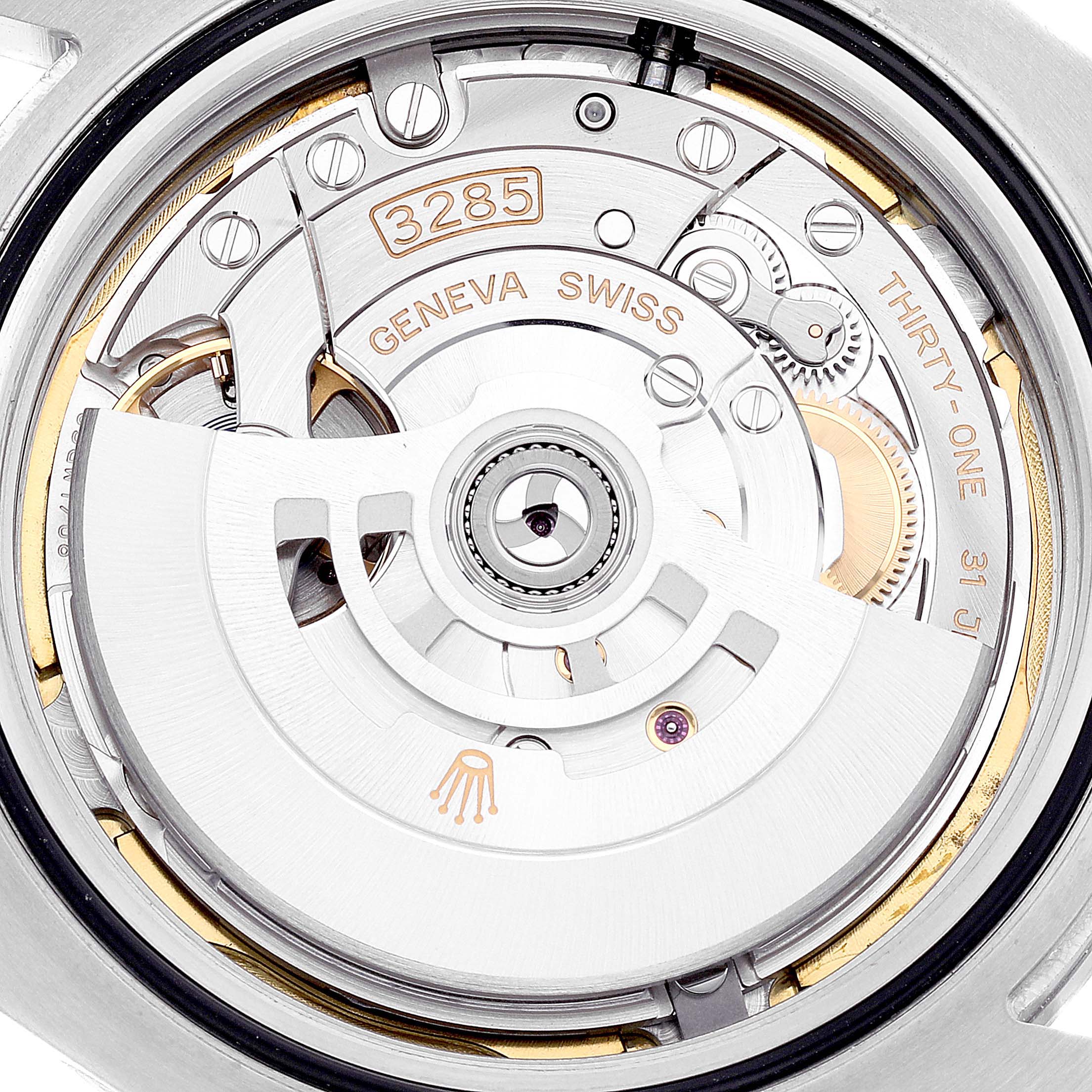 The image shows the movement and internal mechanism of the Rolex Explorer Men's Stainless Steel Black Dial Men's Stainless Steel Black Dial model watch, including the rotor and parts marked 3285.