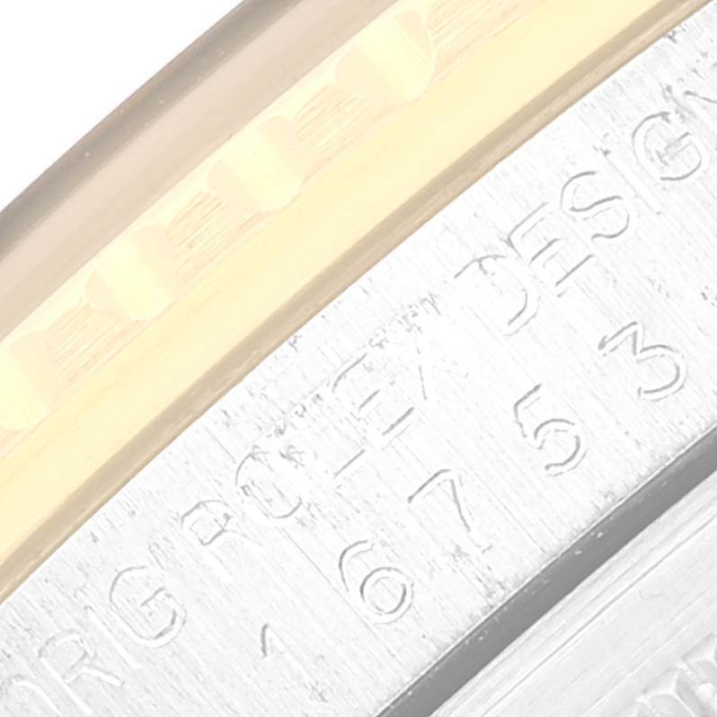 The image shows a close-up of the edge of the bezel and engraved case back of a Rolex GMT-Master 16753 Men's Stainless Steel Black Dial 16753 Men's Stainless Steel Black Dial watch.