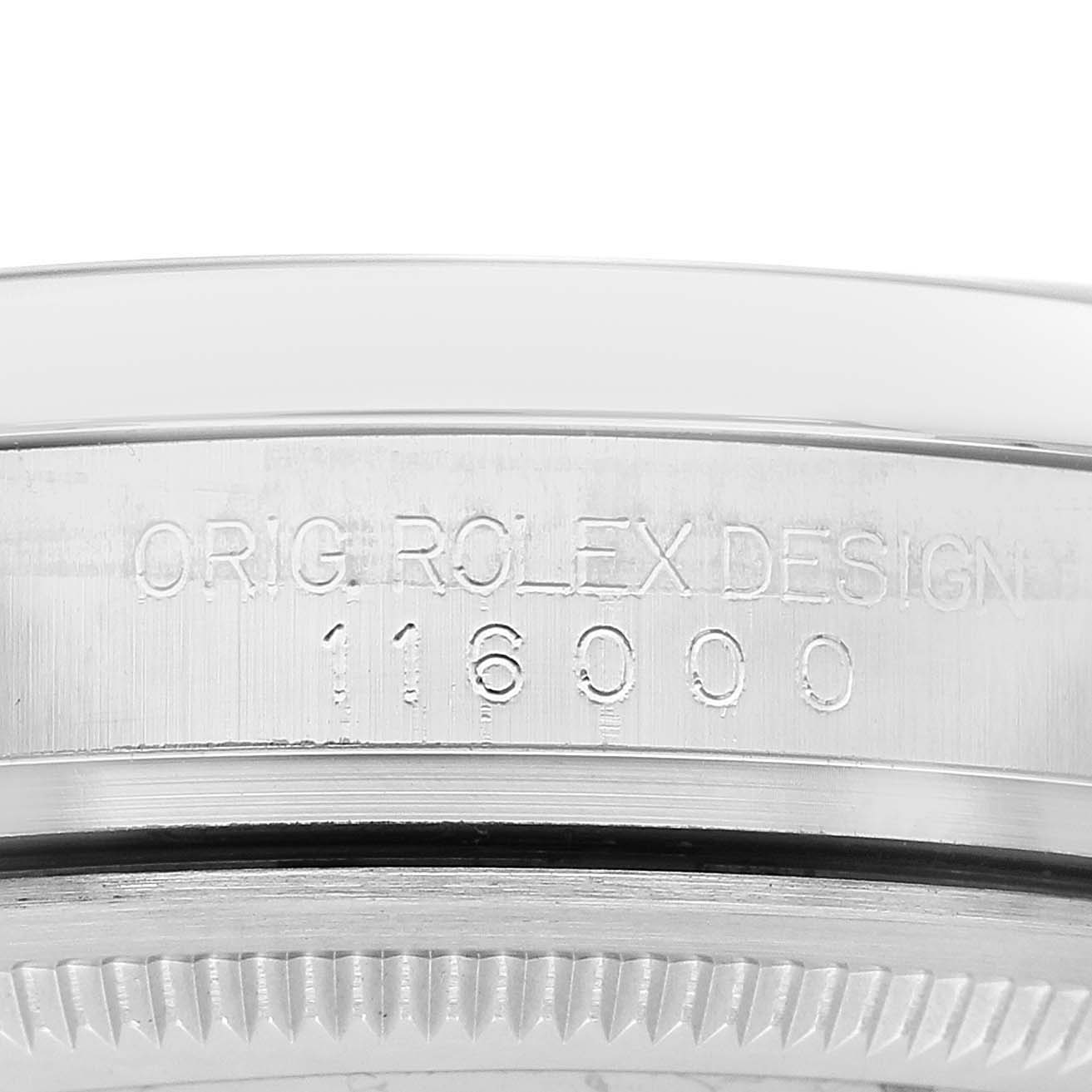 The image shows the side of the bezel on a Rolex Oyster Perpetual 116000 Men's Stainless Steel Blue Dial, featuring the engraved model number 116000.