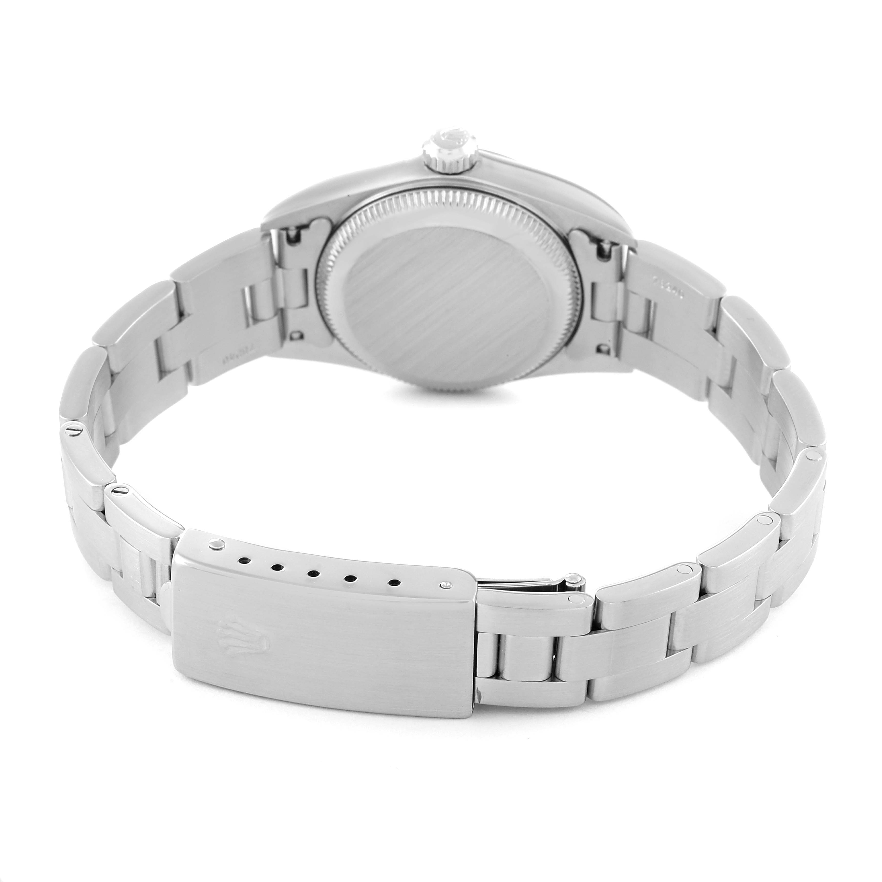 The image shows the back of the Rolex Oyster Perpetual 76080 Women
s Stainless Steel Pink Dial 76080 Women
s Stainless Steel Pink Dial watch, highlighting the case back and metal bracelet with a clasp.