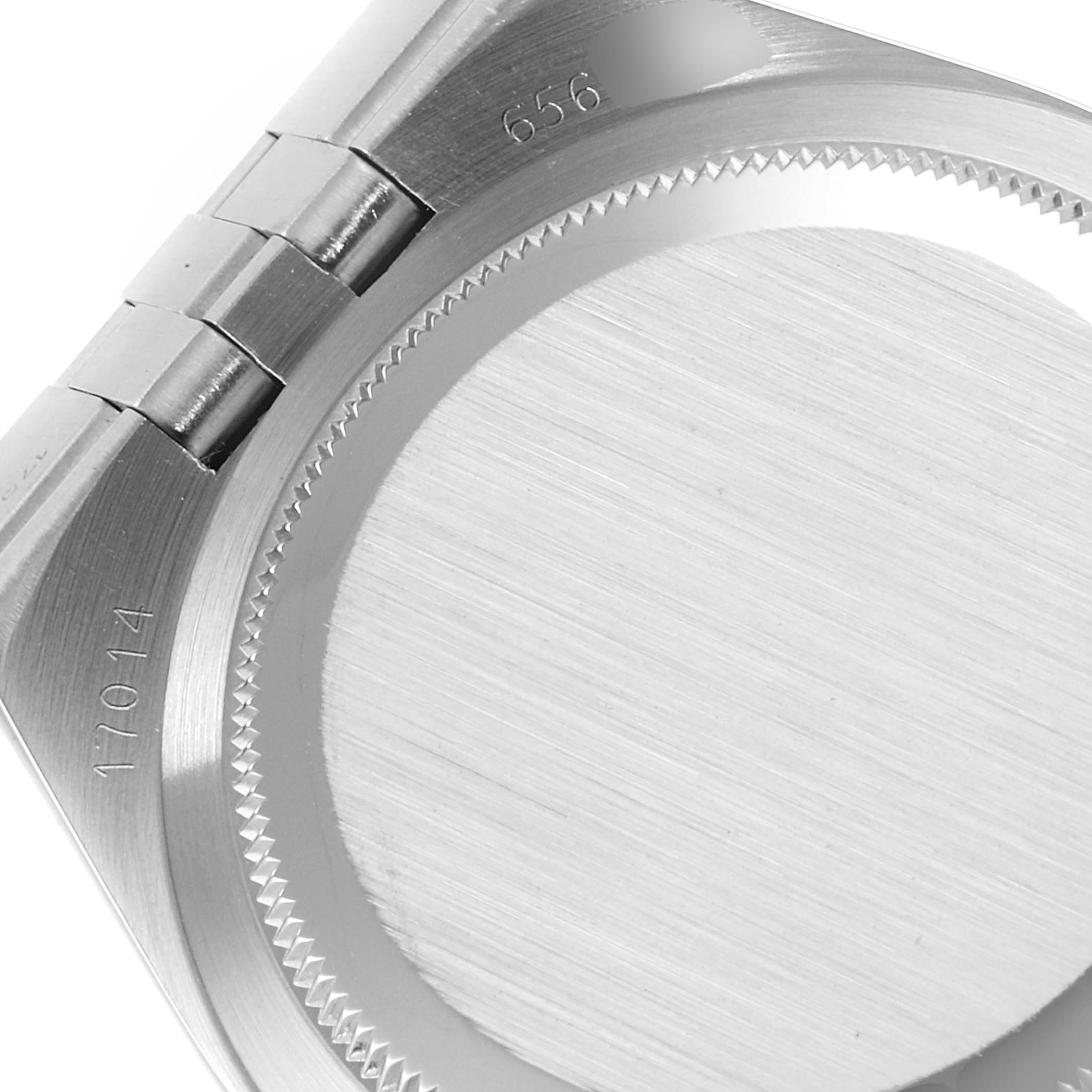 This image shows a close-up of the case back and part of the bracelet of a Rolex Oysterquartz 17014 Men
s Stainless Steel Silver Dial 17014 Men
s Stainless Steel Silver Dial watch, focusing on the hinges and engraved numbers.