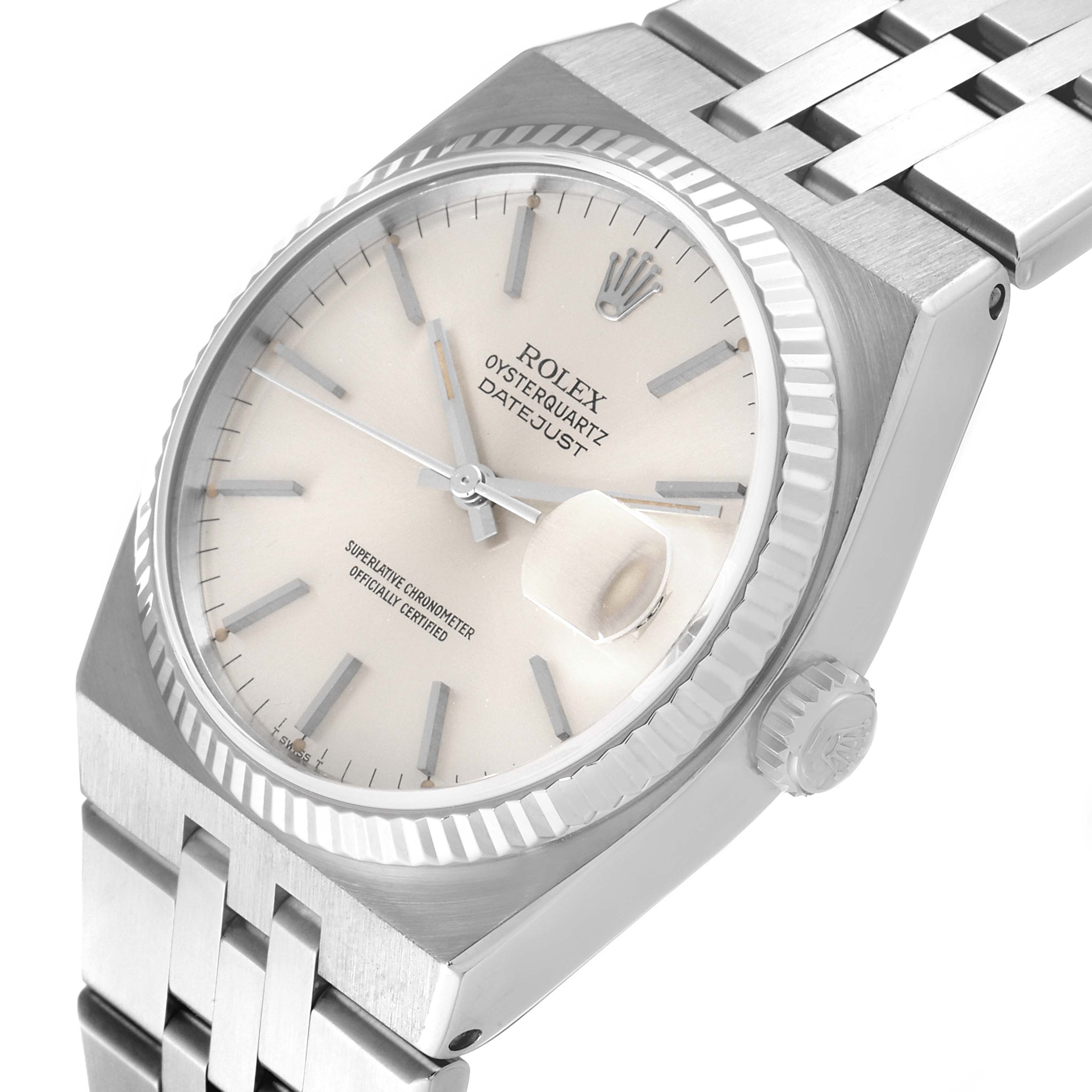 The image shows a diagonal view of the Rolex Oysterquartz 17014 Men
s Stainless Steel Silver Dial 17014 Men
s Stainless Steel Silver Dial watch, highlighting its dial, fluted bezel, bracelet, and crown.