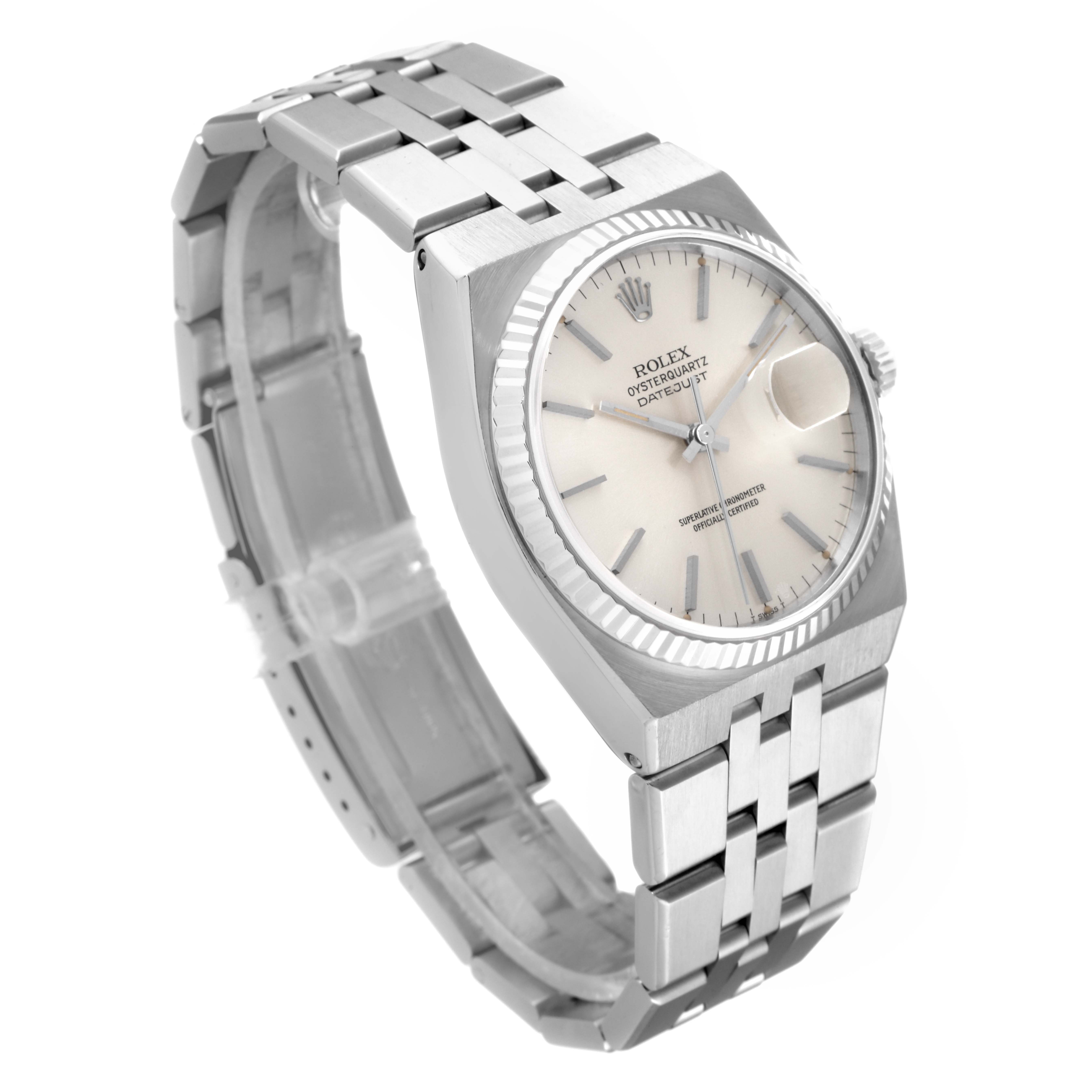 The image shows a Rolex Oysterquartz 17014 Men
s Stainless Steel Silver Dial 17014 Men
s Stainless Steel Silver Dial watch at an angle revealing the face, bezel, and metallic bracelet.