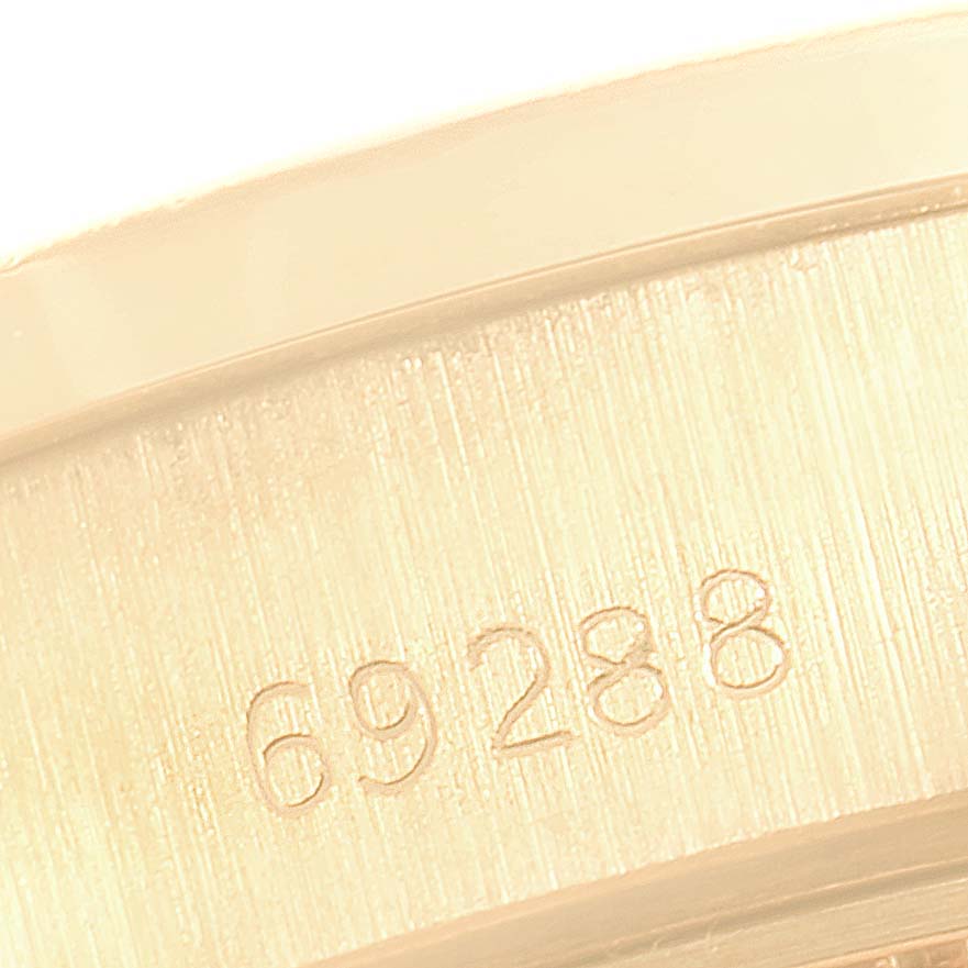 This close-up image shows the model number "69288" etched on the case of the Rolex President 69288 Women
s Yellow Gold Champagne Dial 69288 Women
s Yellow Gold Champagne Dial watch.