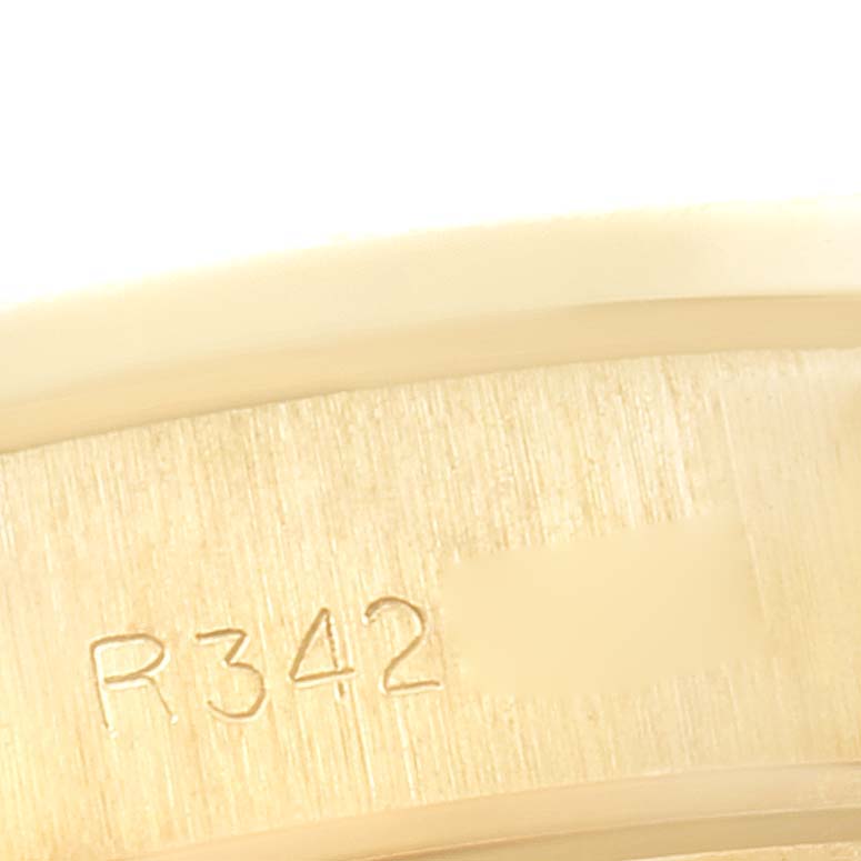 This image shows a close-up of the inner band with engraved markings of a Rolex President 69288 Women
s Yellow Gold Champagne Dial 69288 Women
s Yellow Gold Champagne Dial model watch.
