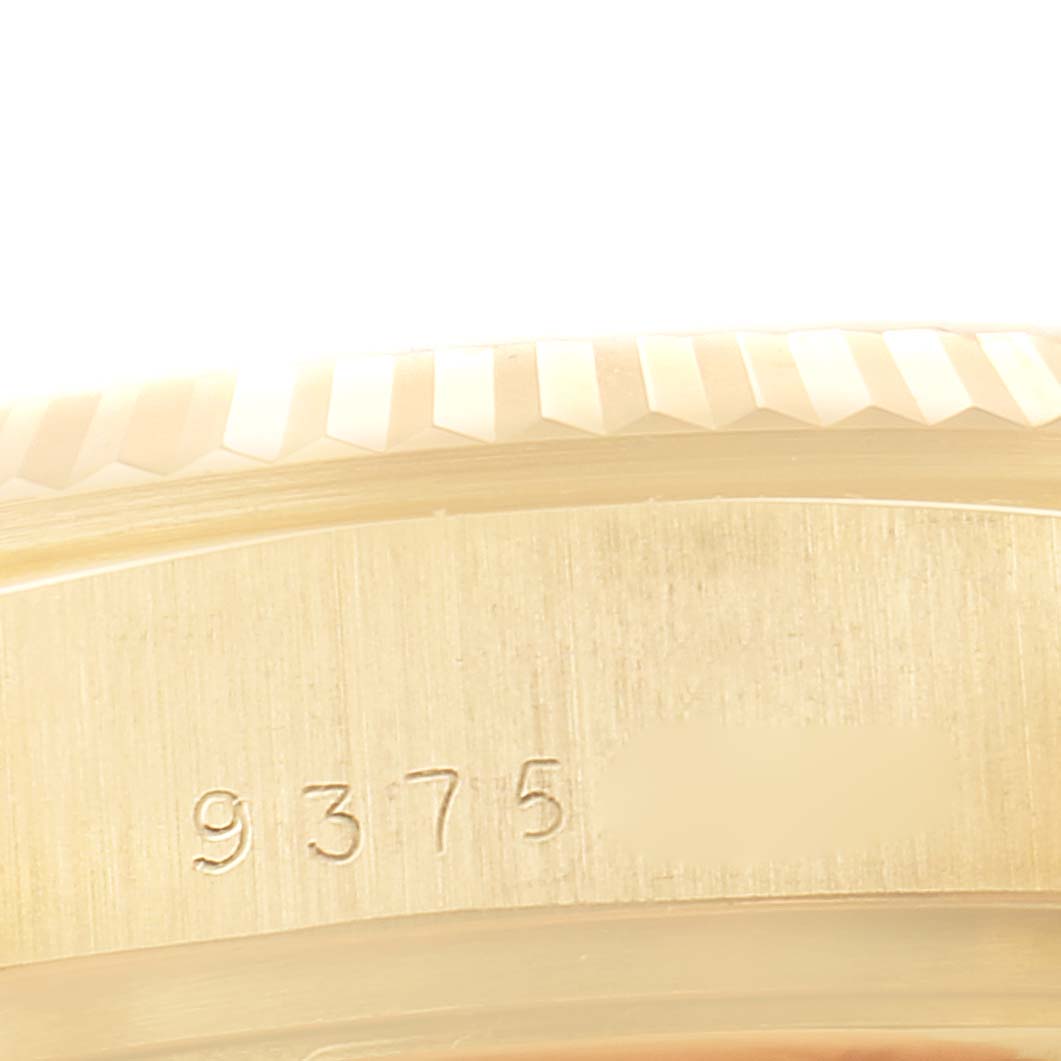 This close-up image shows the serial number engraved on the side of the bezel and case of a Rolex President 18038 Men's Yellow Gold Champagne Dial 18038 Men's Yellow Gold Champagne Dial model watch.