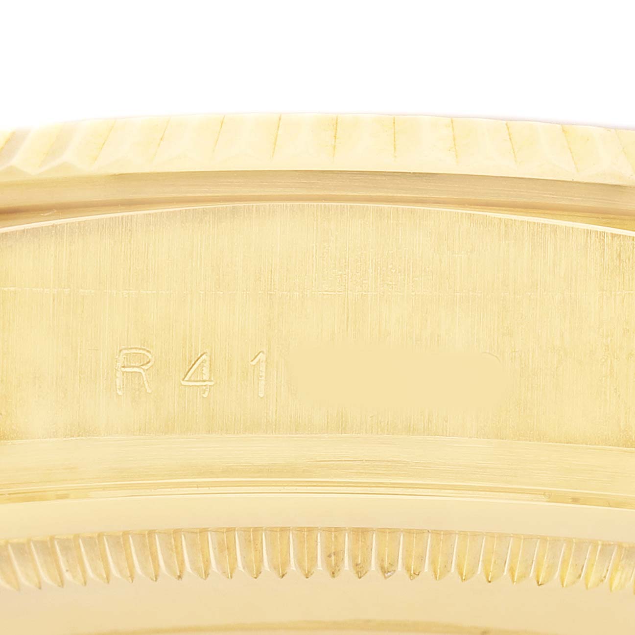 The image shows a close-up of the side casing and serial engraving on the Rolex President 18038 Men's Yellow Gold Champagne Dial model.