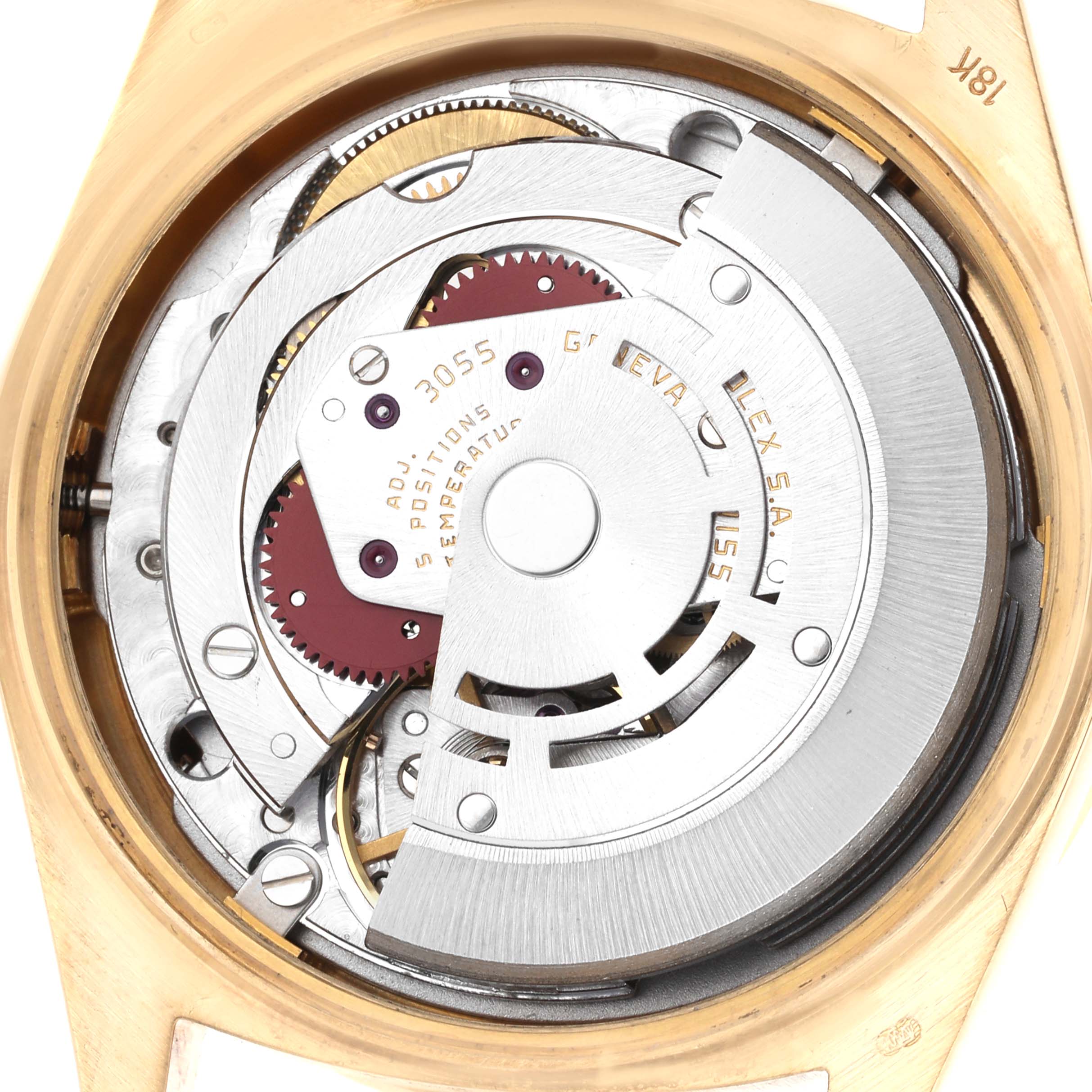 The image shows the movement of a Rolex President 18108 Men
s Yellow Gold Champagne Dial 18108 Men
s Yellow Gold Champagne Dial model, focusing on the intricate internal mechanics from a top view.