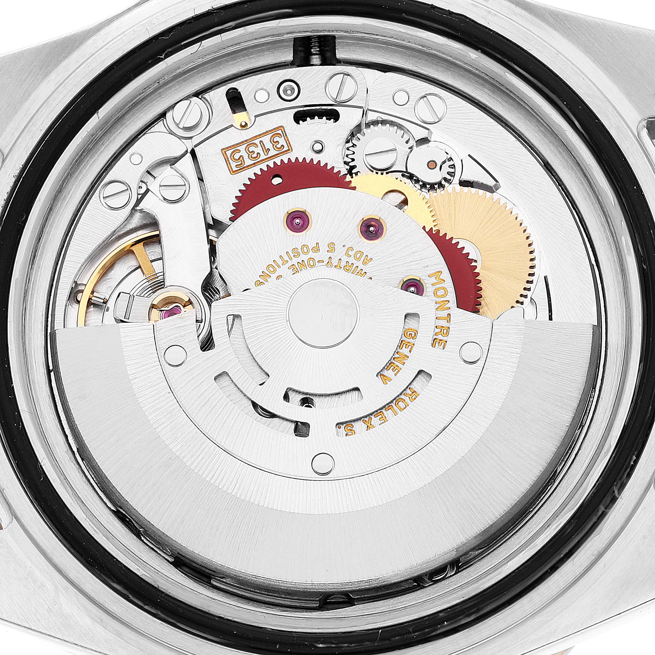 This image shows the intricate movement and inner mechanism of a Rolex Submariner 16613 Men's Steel and Gold (two tone) Blue Dial 16613 Men's Steel and Gold (two tone) Blue Dial watch from a rear angle.