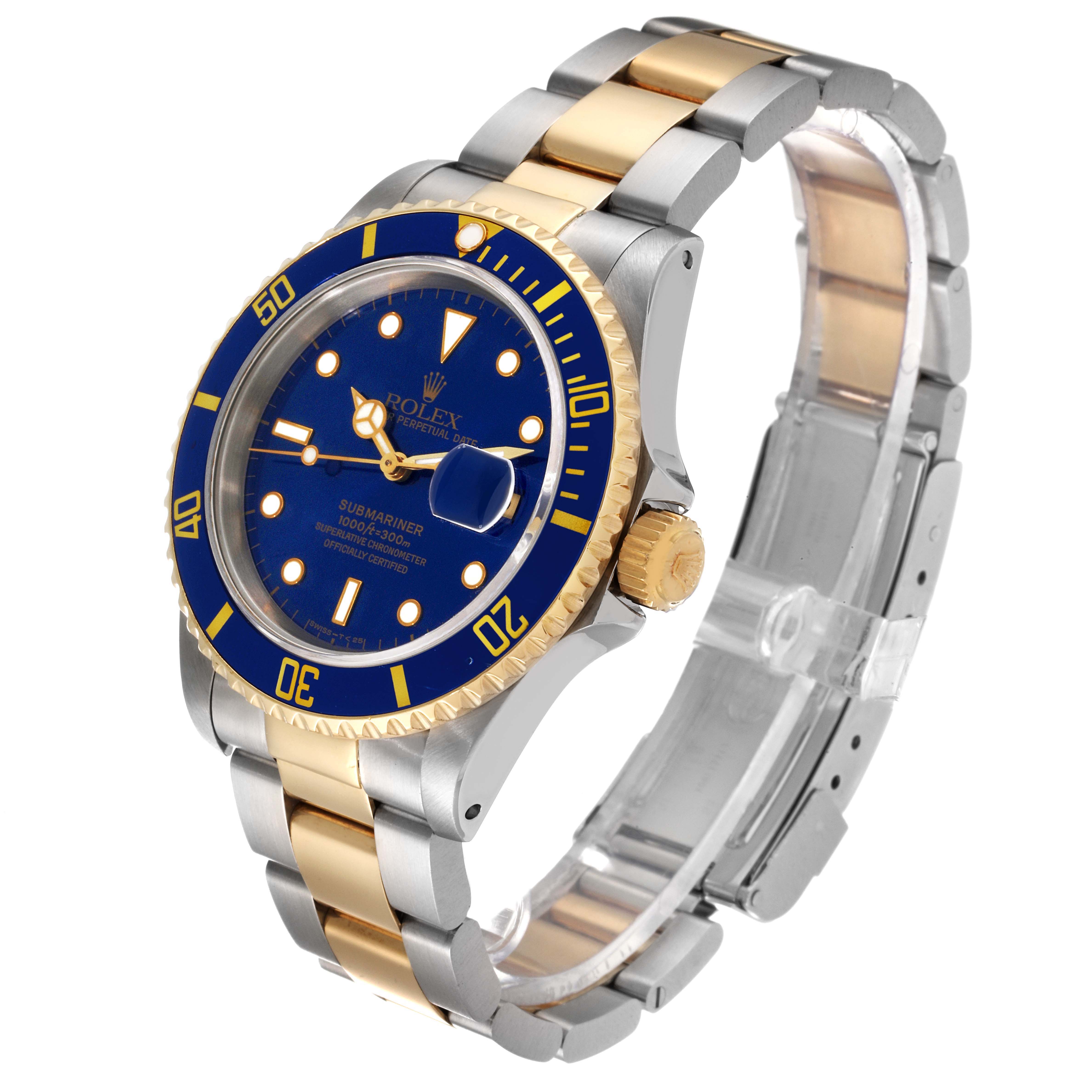 The image shows a Rolex Submariner 16613 Men's Steel and Gold (two tone) Blue Dial 16613 Men's Steel and Gold (two tone) Blue Dial watch at a 3/4 angle, highlighting its blue dial, bezel, gold accents, and two-tone bracelet.