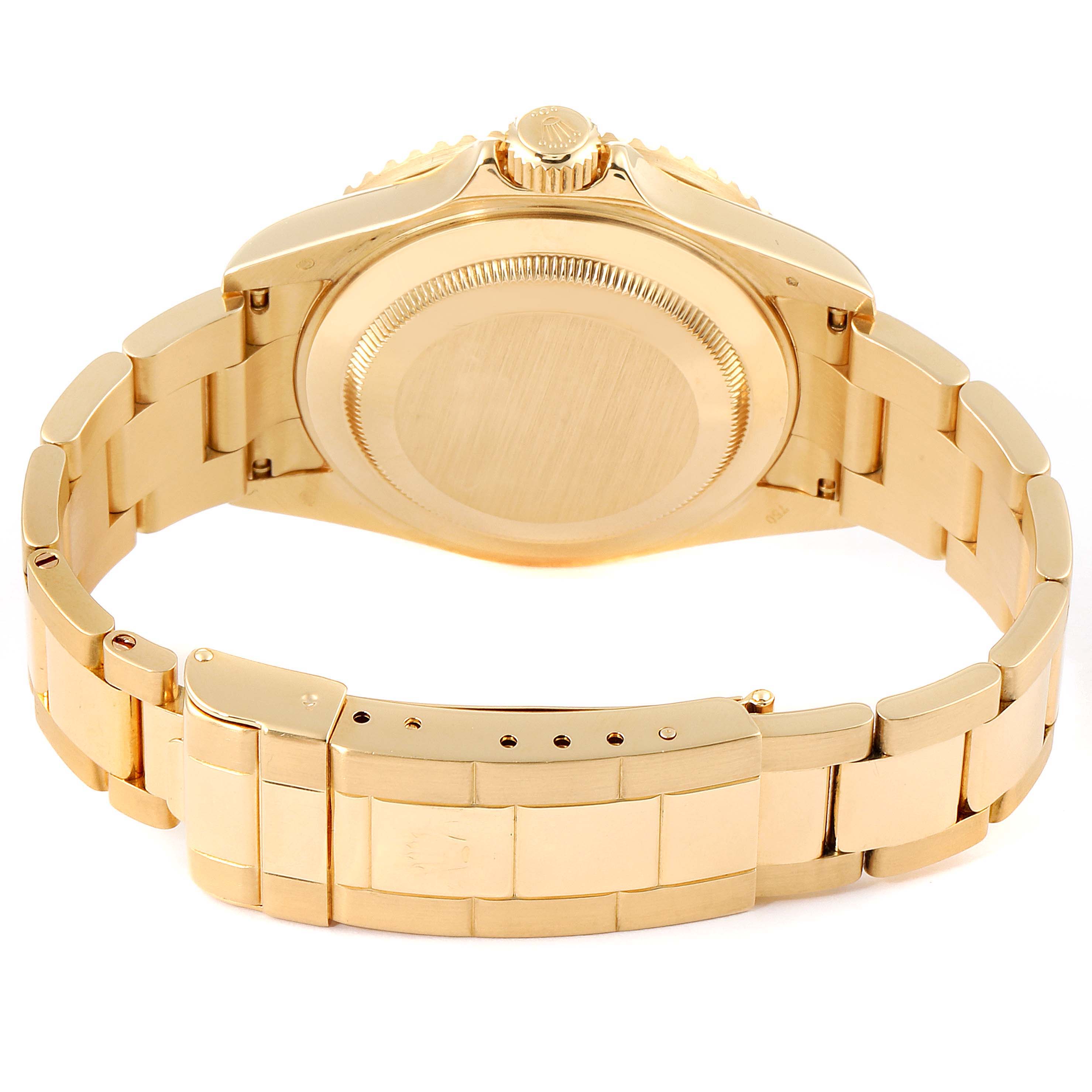 The image shows the back and bracelet clasp of a Rolex Submariner 16618 Men
s Yellow Gold Blue Dial 16618 Men
s Yellow Gold Blue Dial watch, showcasing its gold-toned metallic finish.