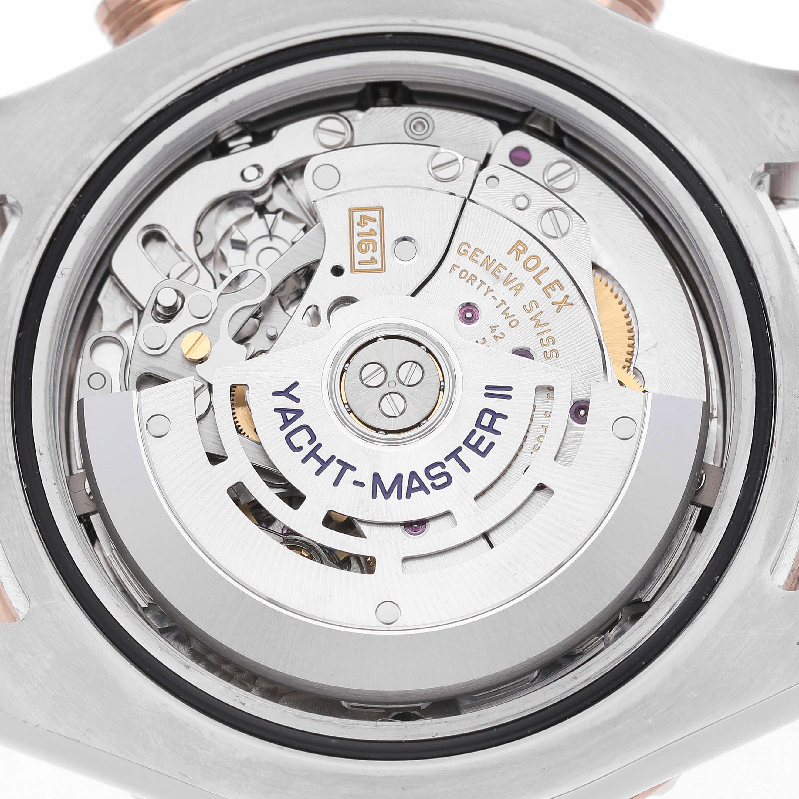 The image shows the back view of the Rolex Yacht-Master 116681M Men's Steel and Gold (two tone) White Dial II, highlighting the movement and rotor.