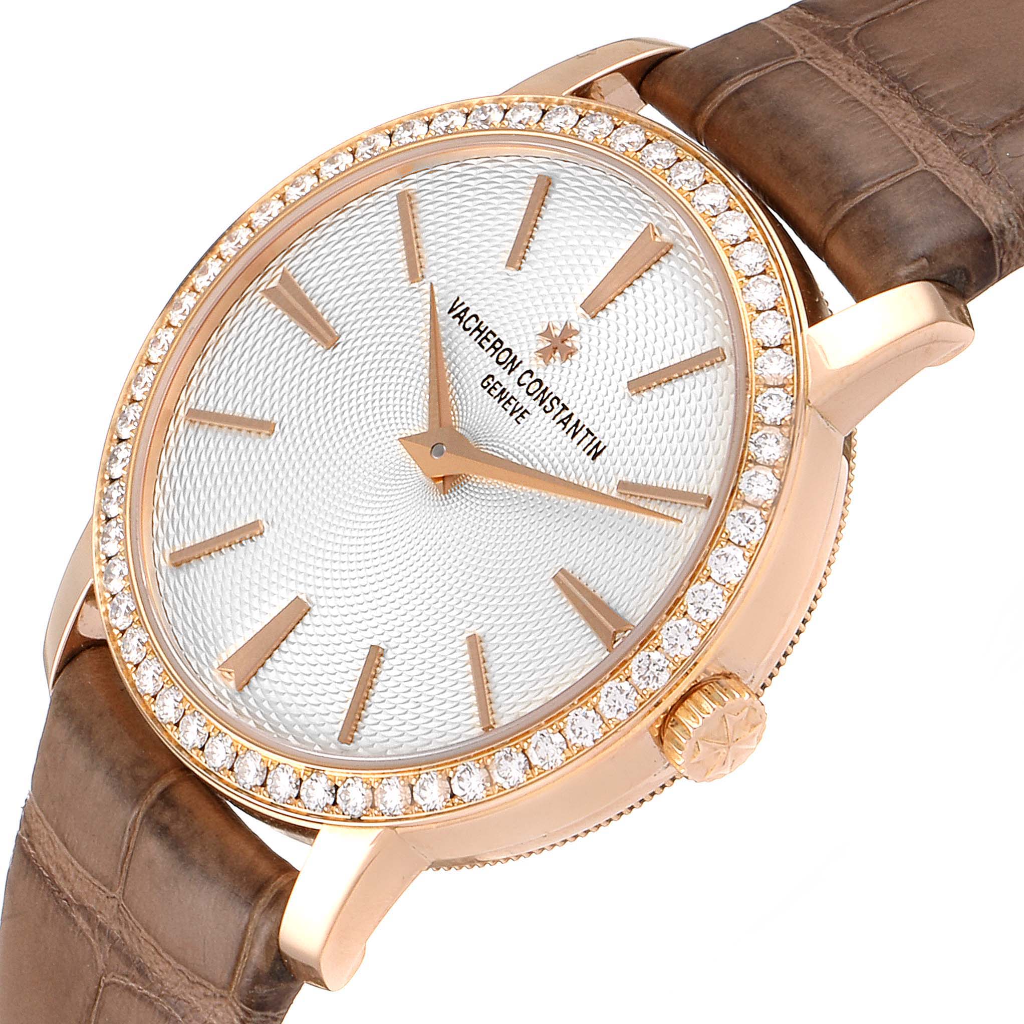 The Vacheron Constantin Traditionnelle 81590/000R-9847 Women's Rose Gold Silver Dial 81590/000R-9847 Women's Rose Gold Silver Dial watch is shown at a slight angle highlighting the diamond-encrusted bezel and brown leather strap.